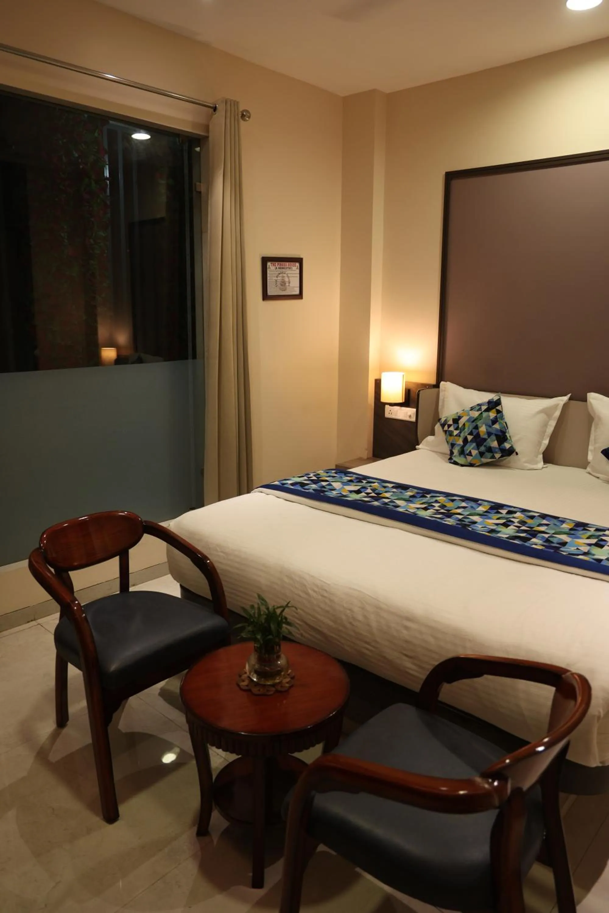 Bed in Hotel Pinaka Inn