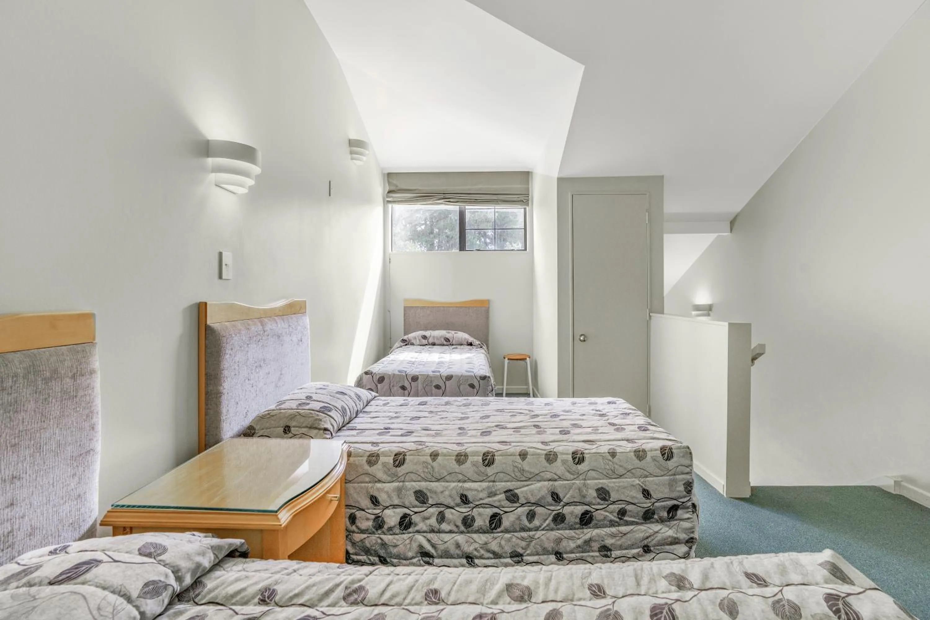 Bed in Capital Lodge Motor Inn