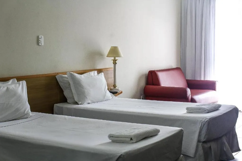 Bed in Bravo Suites São Carlos