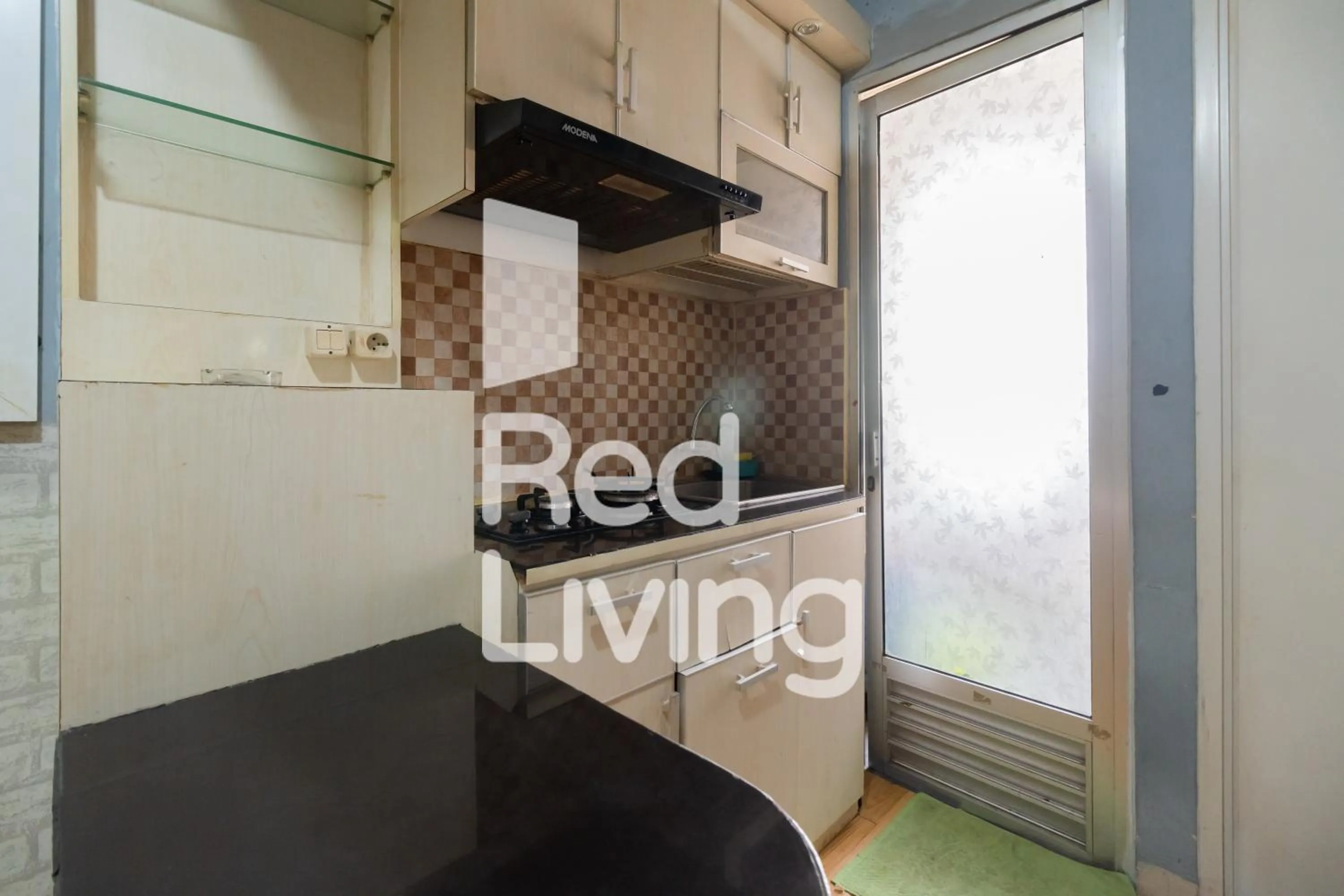 Kitchen or kitchenette in RedLiving Apartemen Kalibata City - SAG Property Tower Kemuning