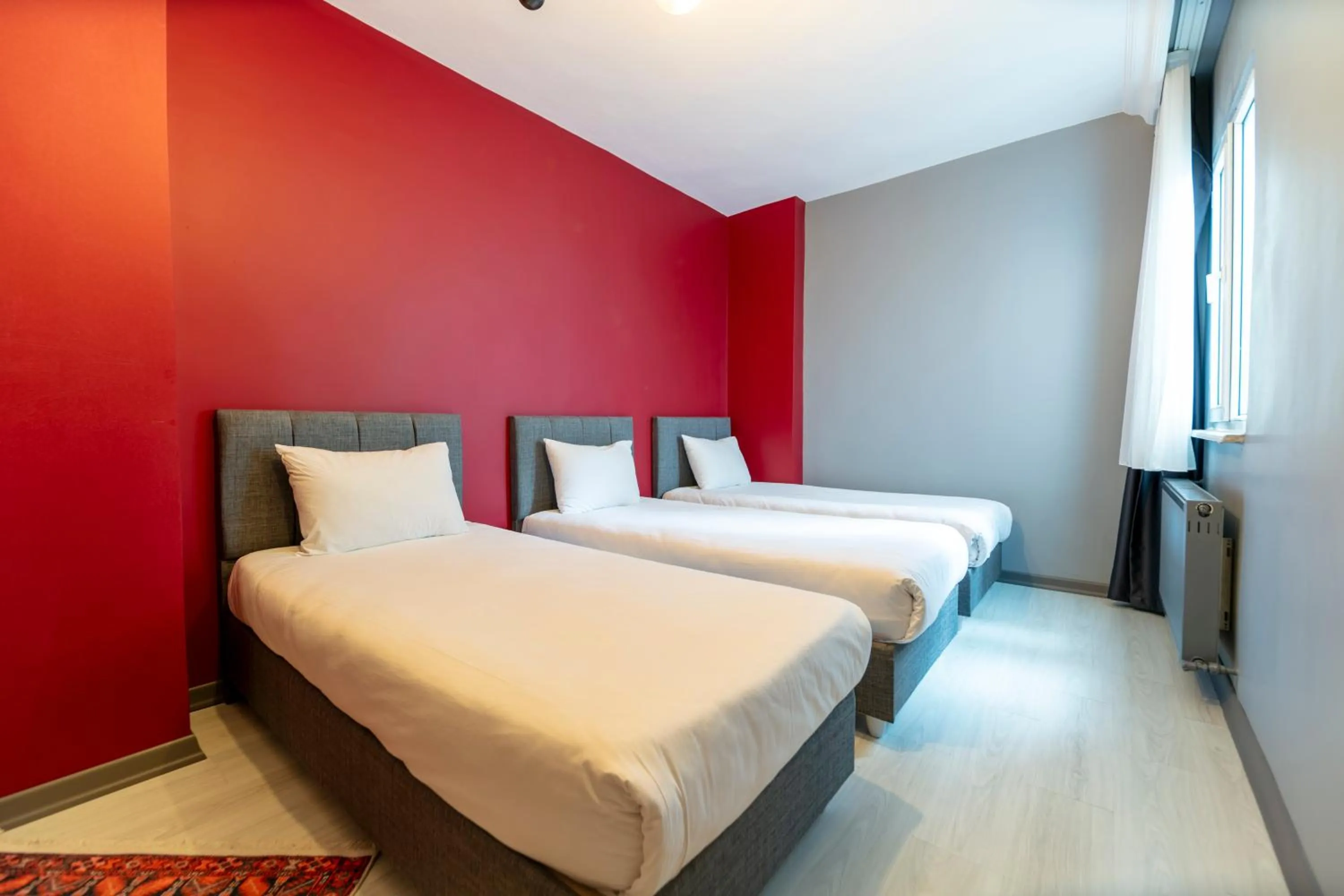 Bed in Hexa Suites Hotel