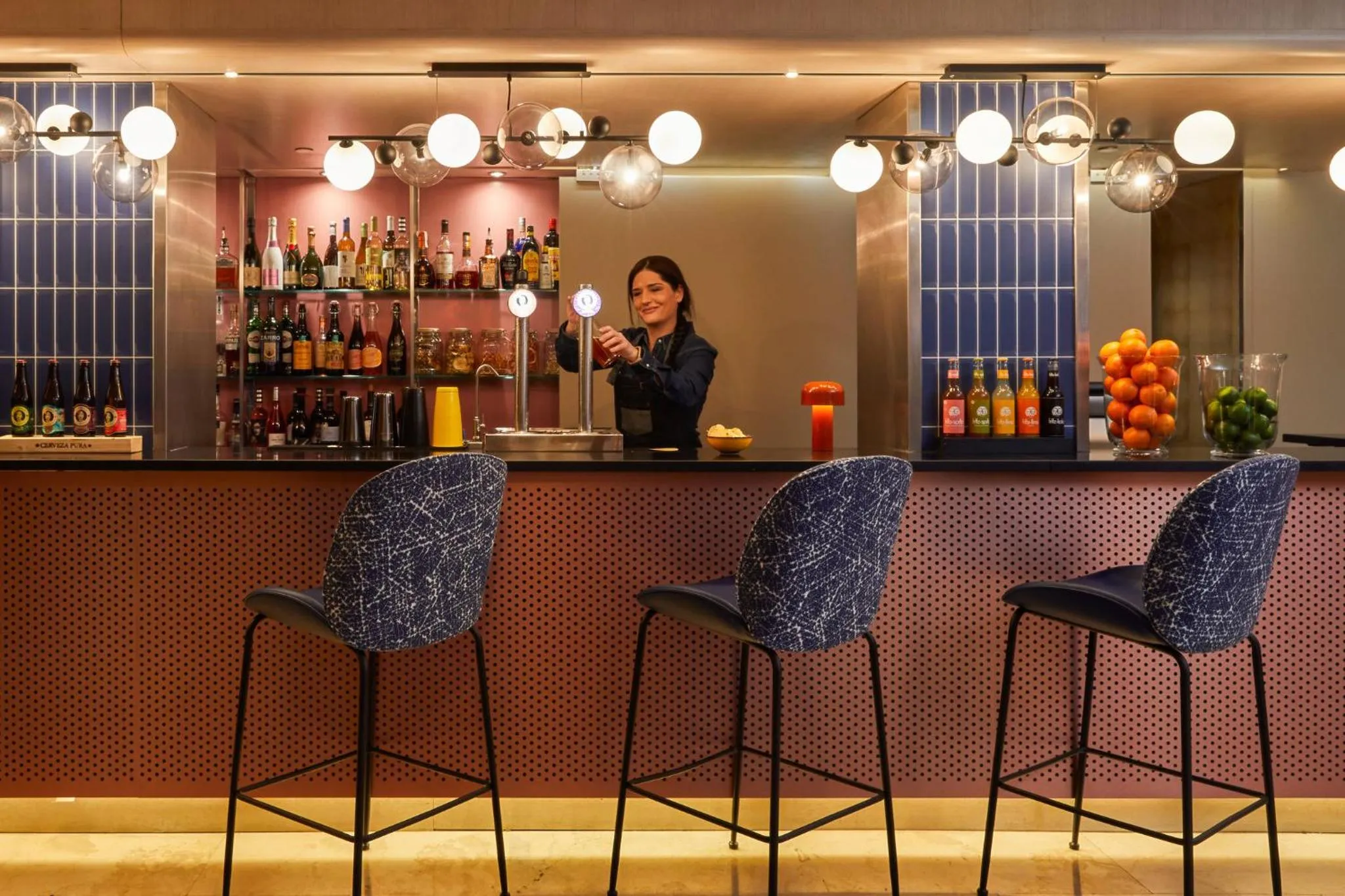 Lounge or bar in voco Madrid Retiro by IHG