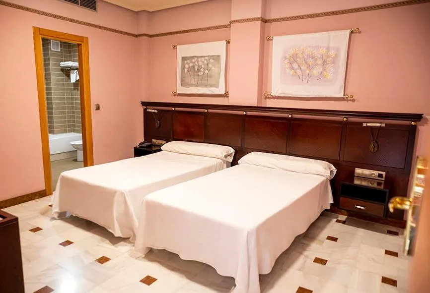 Bed in Hotel Don Miguel Plaza