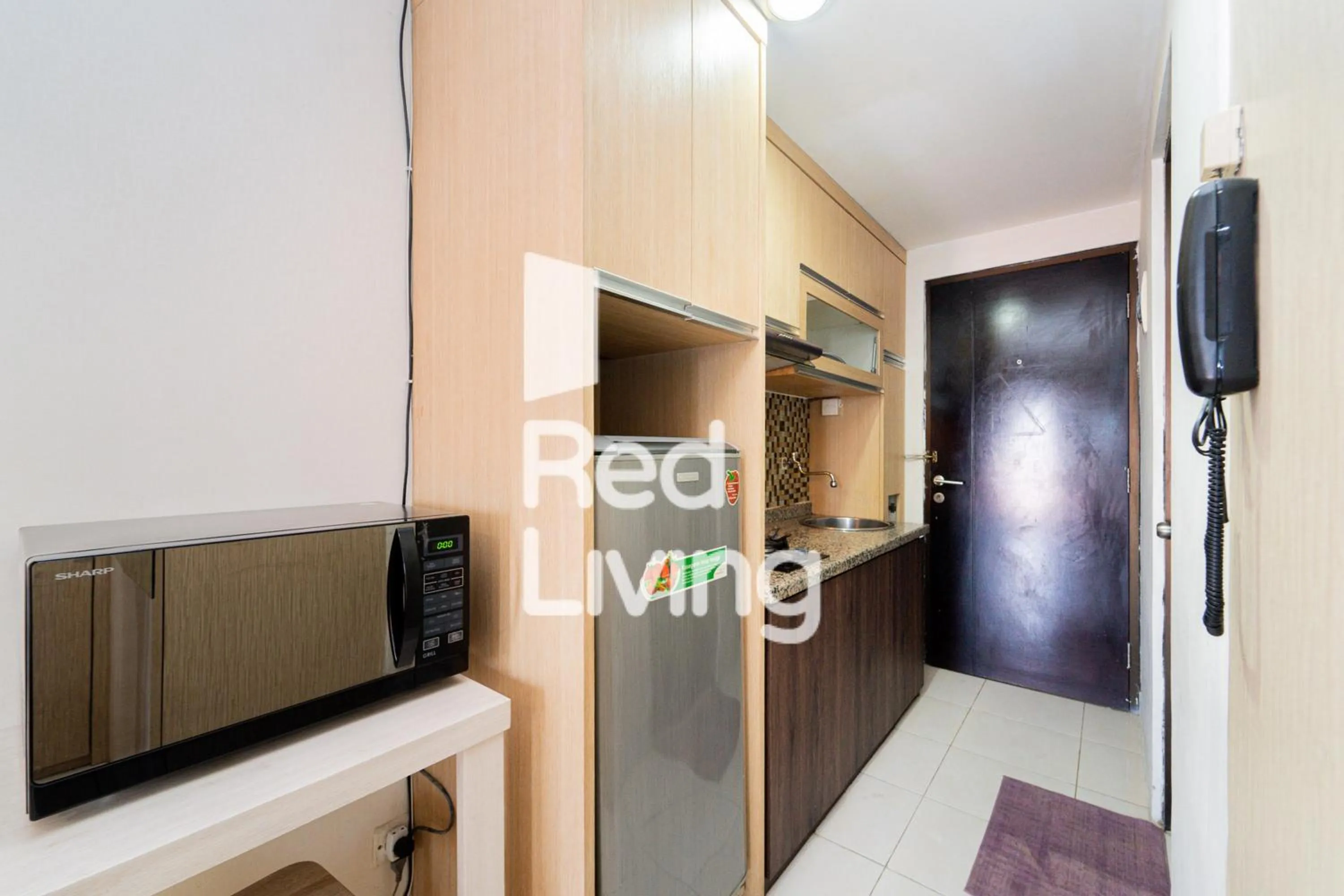 Kitchen or kitchenette in RedLiving Apartemen Tamansari Sudirman - Abdi Home