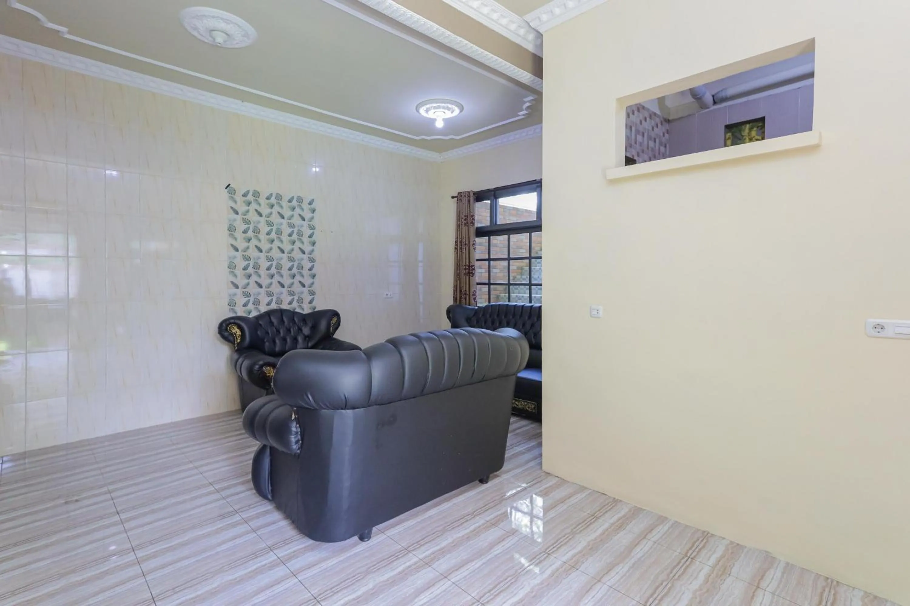 Living room in RedDoorz Plus @ Villa Bontes Batu