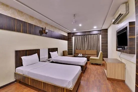 Bed in hotel puneet international