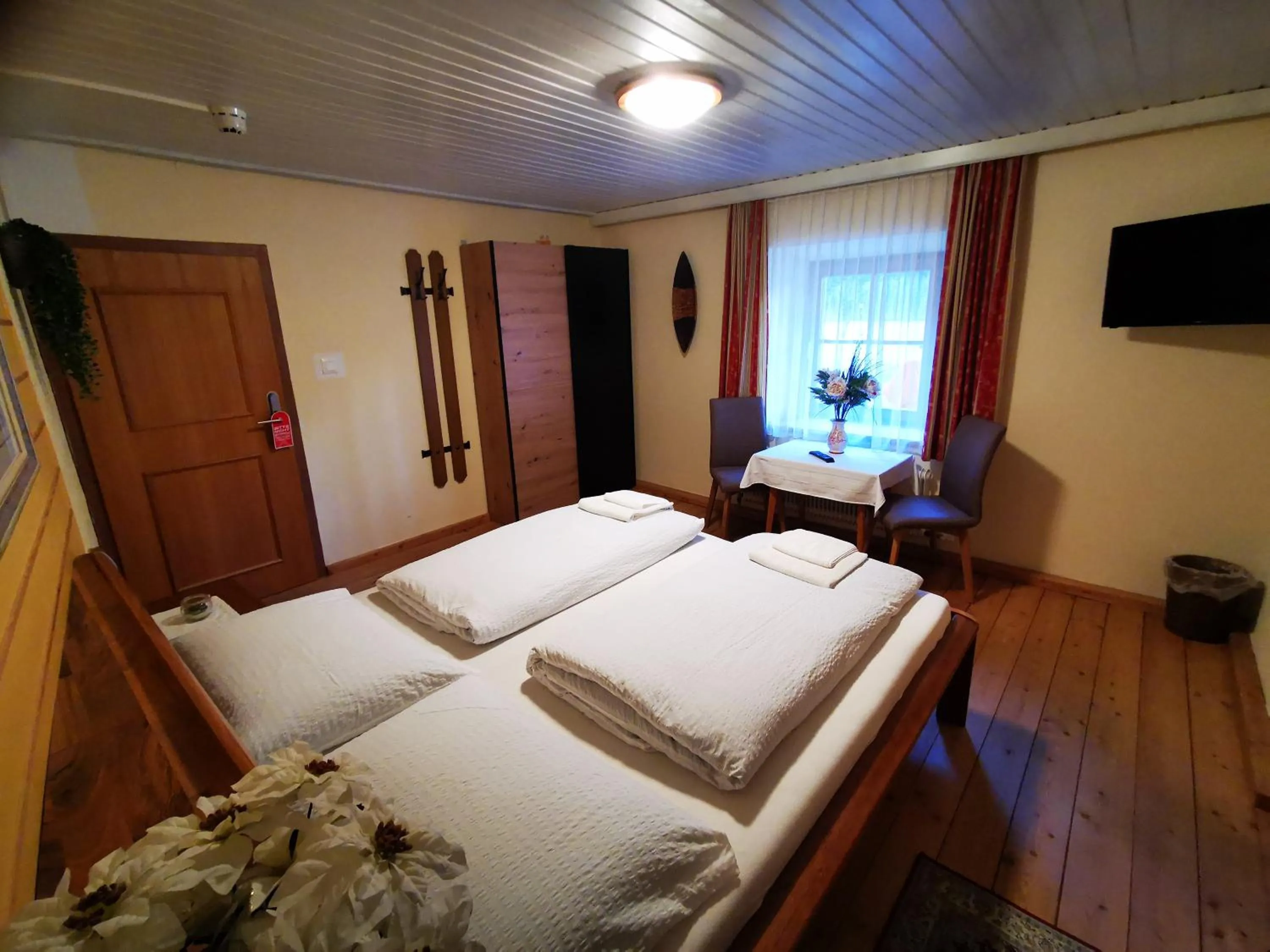 Photo of the whole room, Bed in Gasthof Geronimo