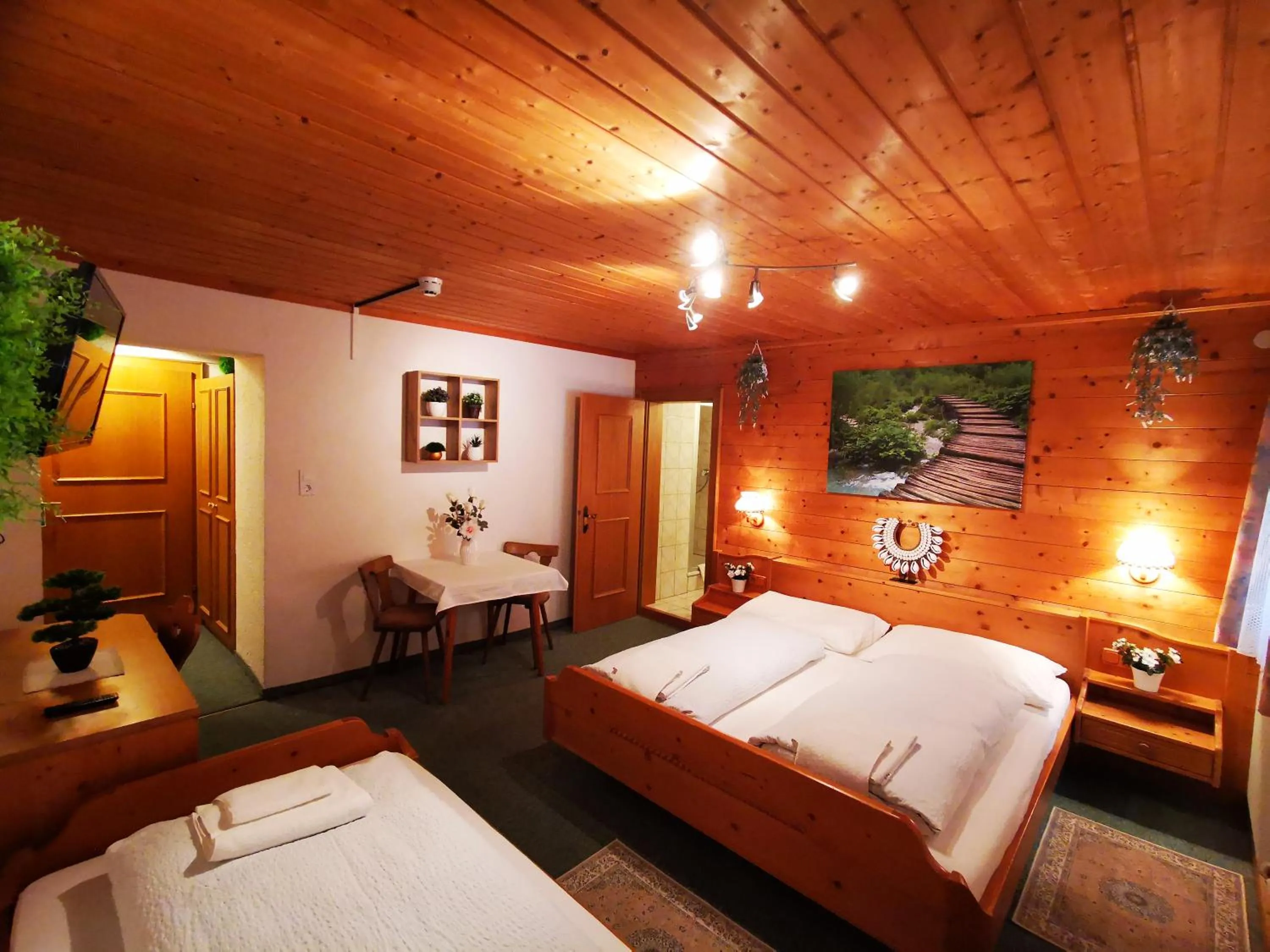 Photo of the whole room, Bed in Gasthof Geronimo