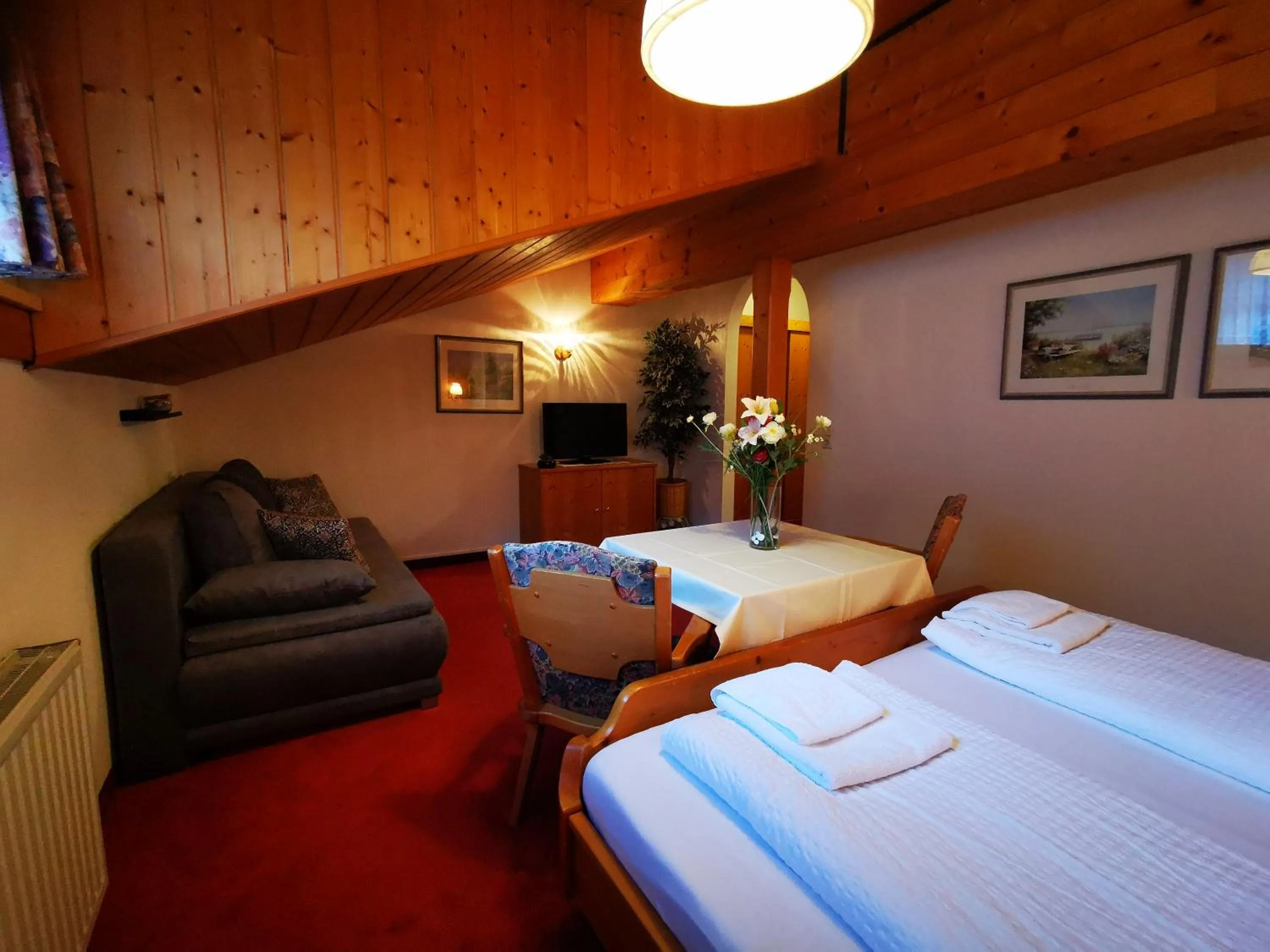 Photo of the whole room, Bed in Gasthof Geronimo