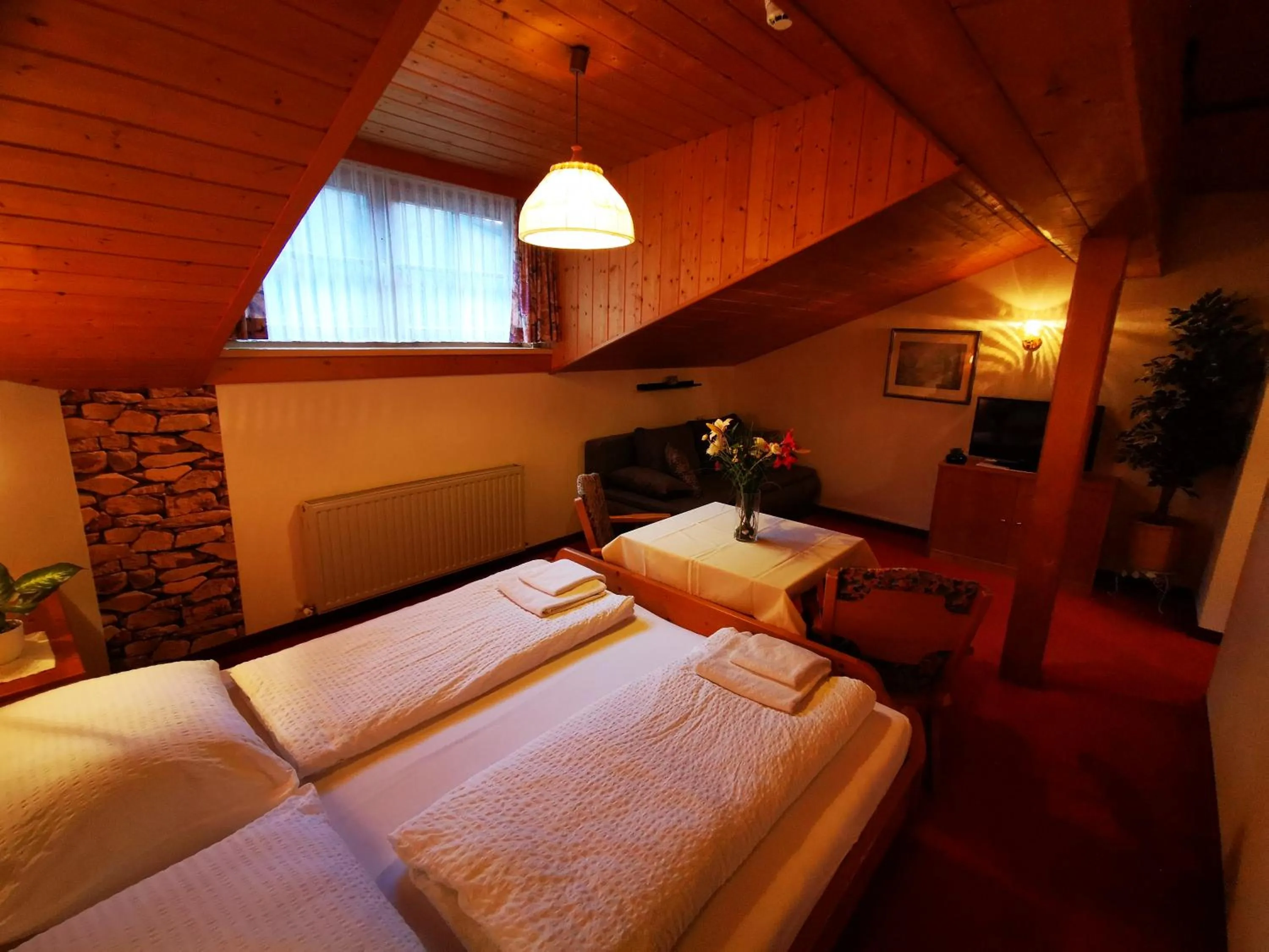 Photo of the whole room, Bed in Gasthof Geronimo