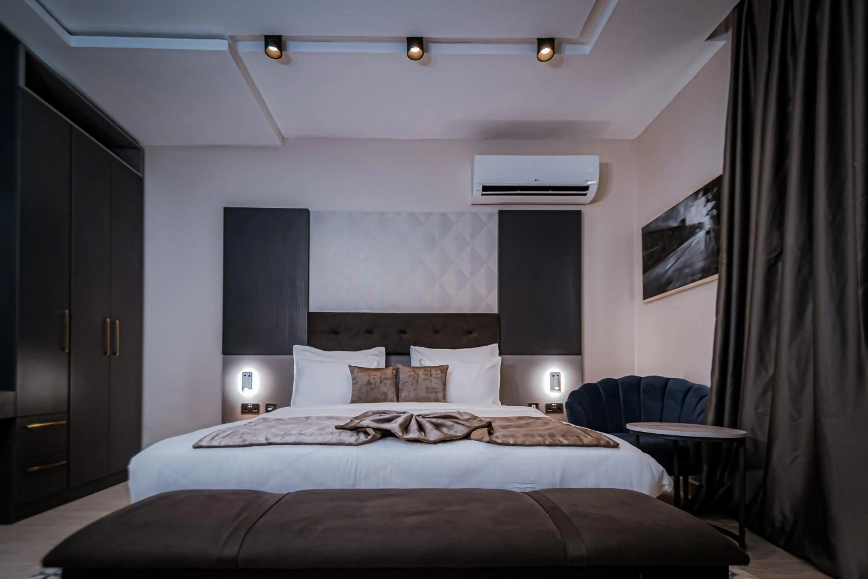 Bed in Wali's Suites