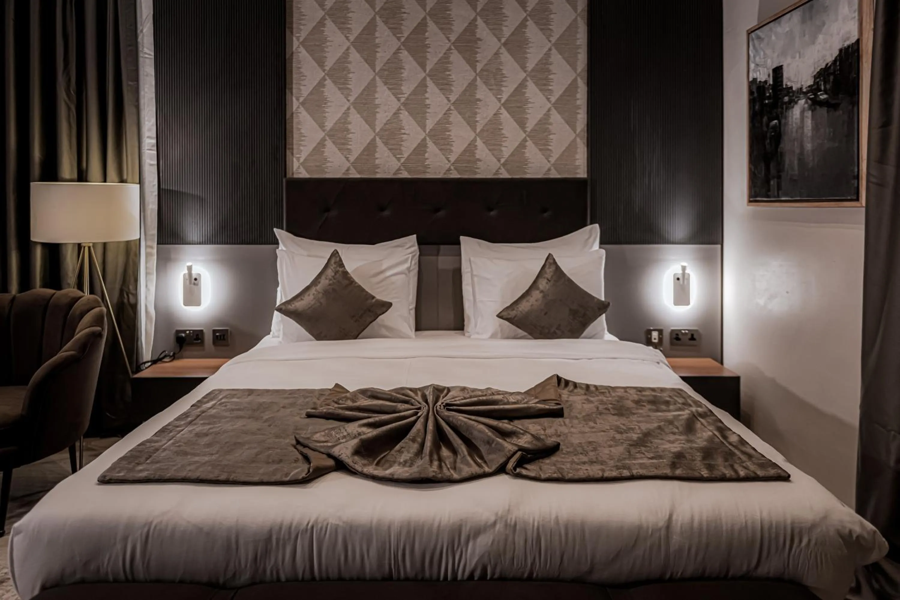 Bed in Wali's Suites