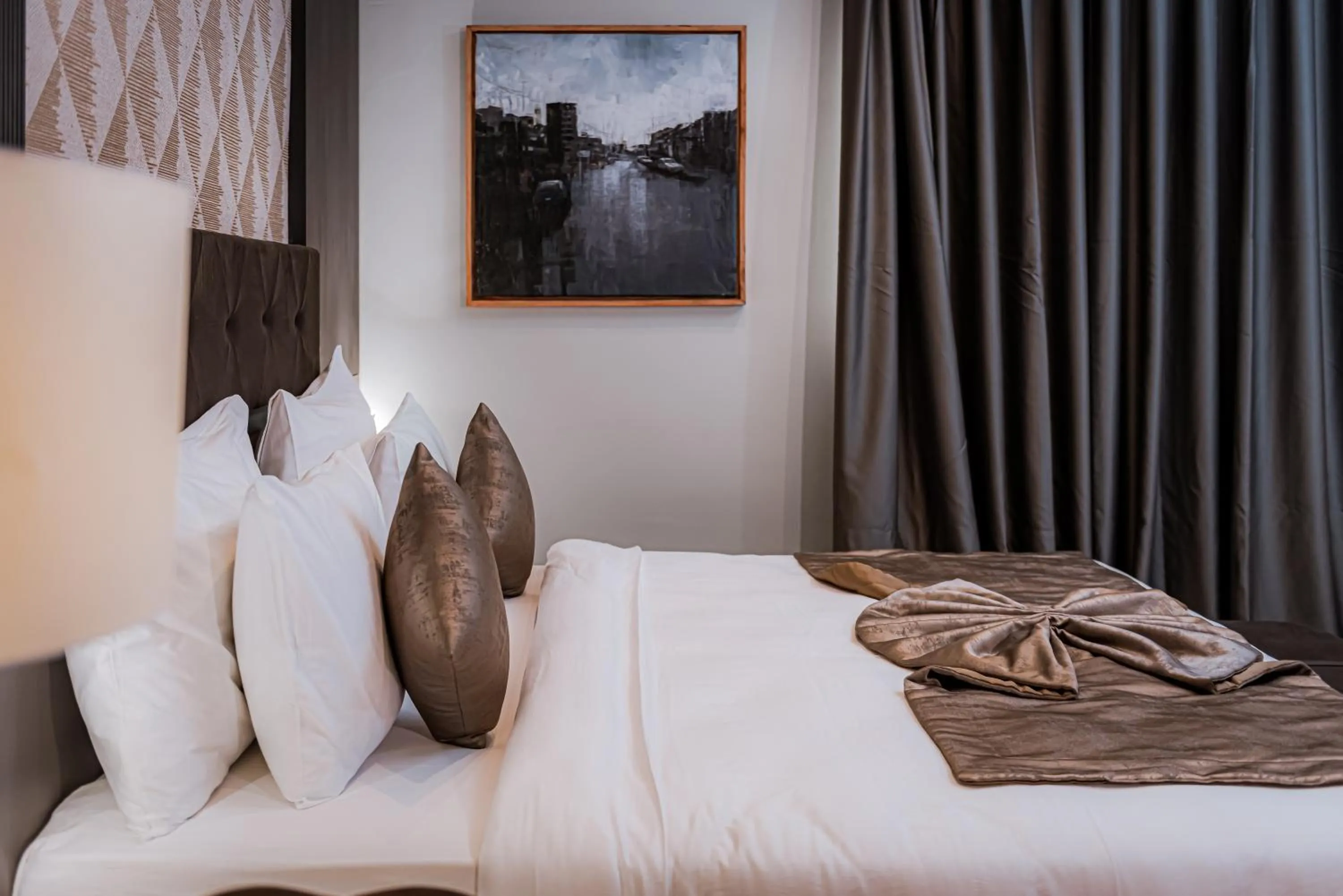 Bed in Wali's Suites