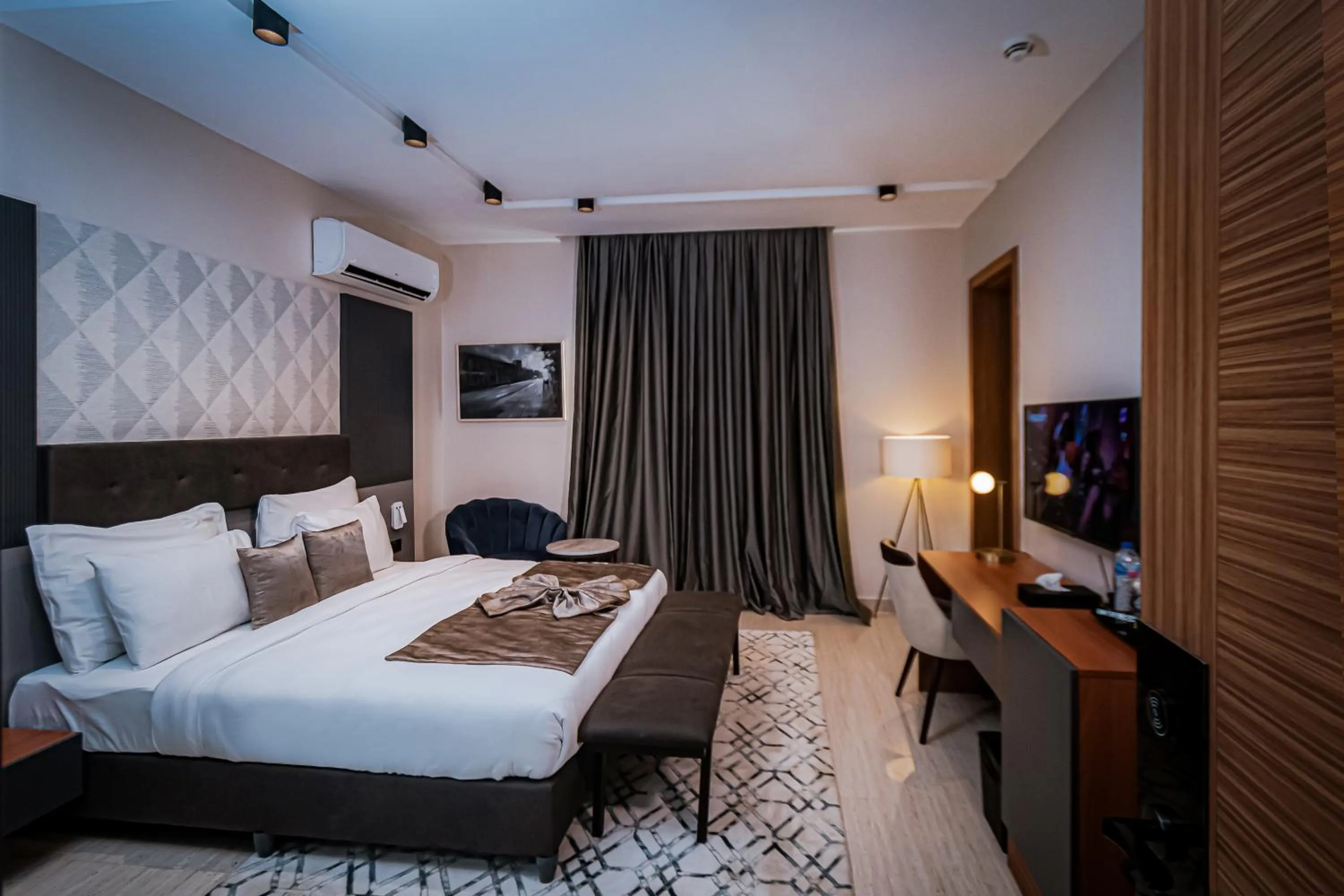 Bed in Wali's Suites