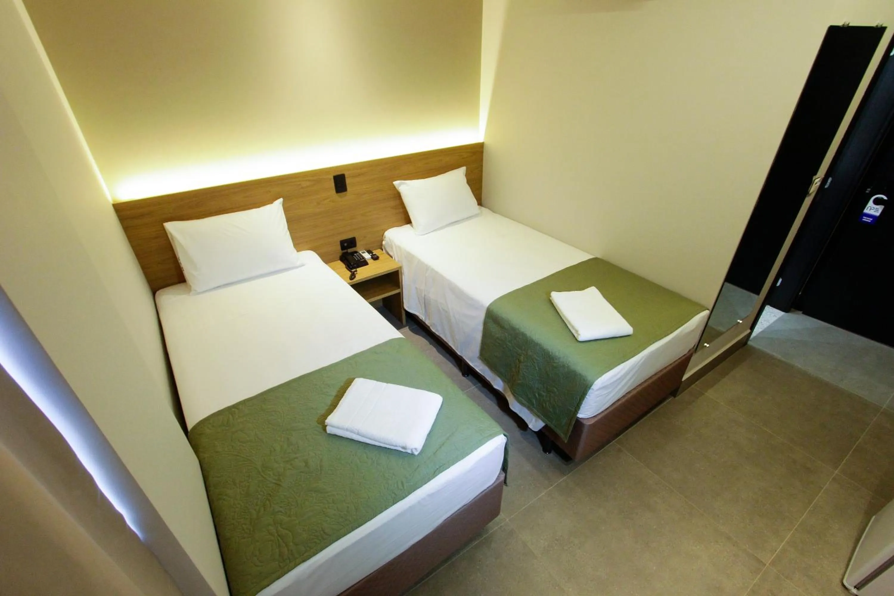 Bed in NEO PARK HOTEL