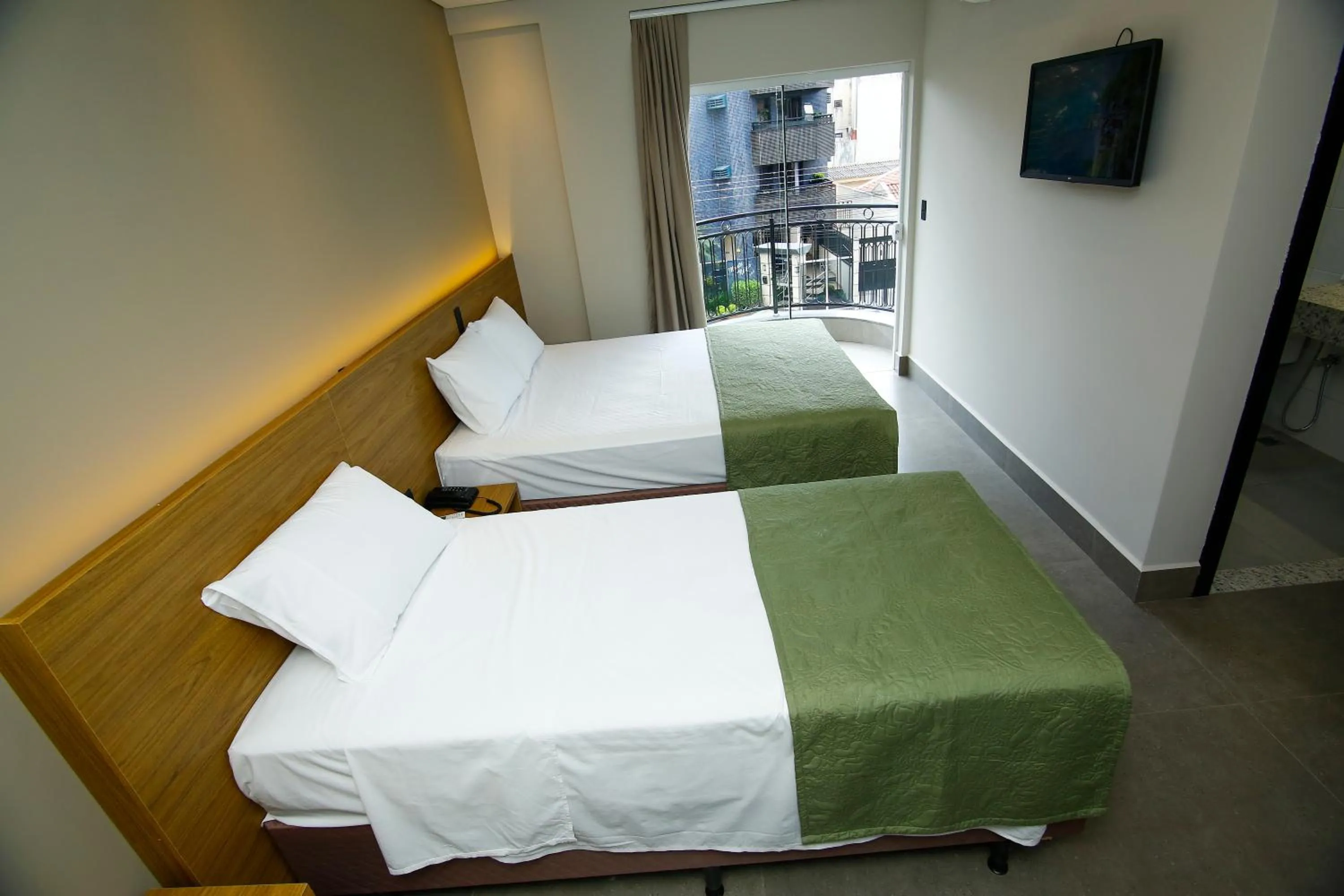 Bed in NEO PARK HOTEL
