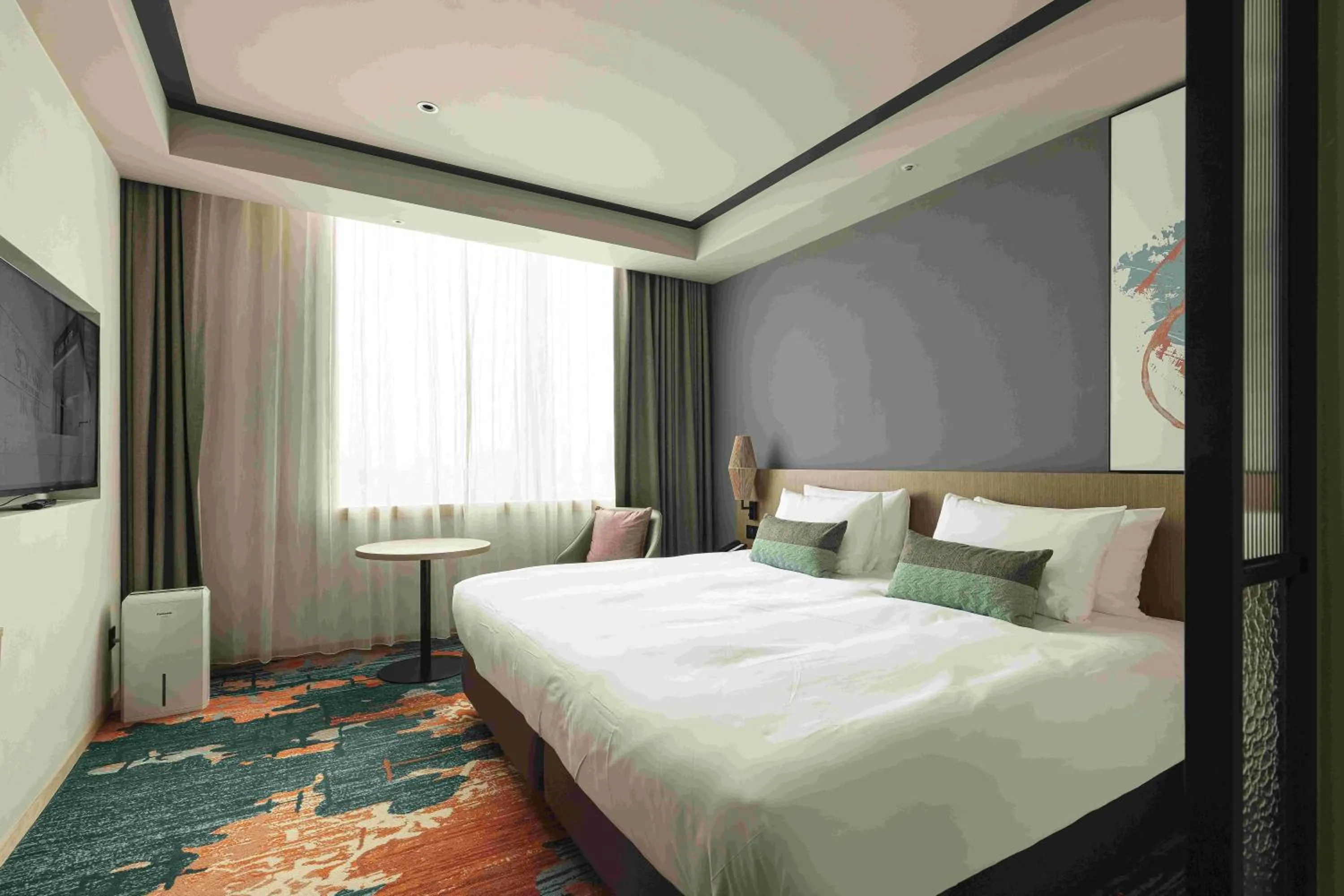 Bed in Solaria Nishitetsu Hotel Taipei Ximen