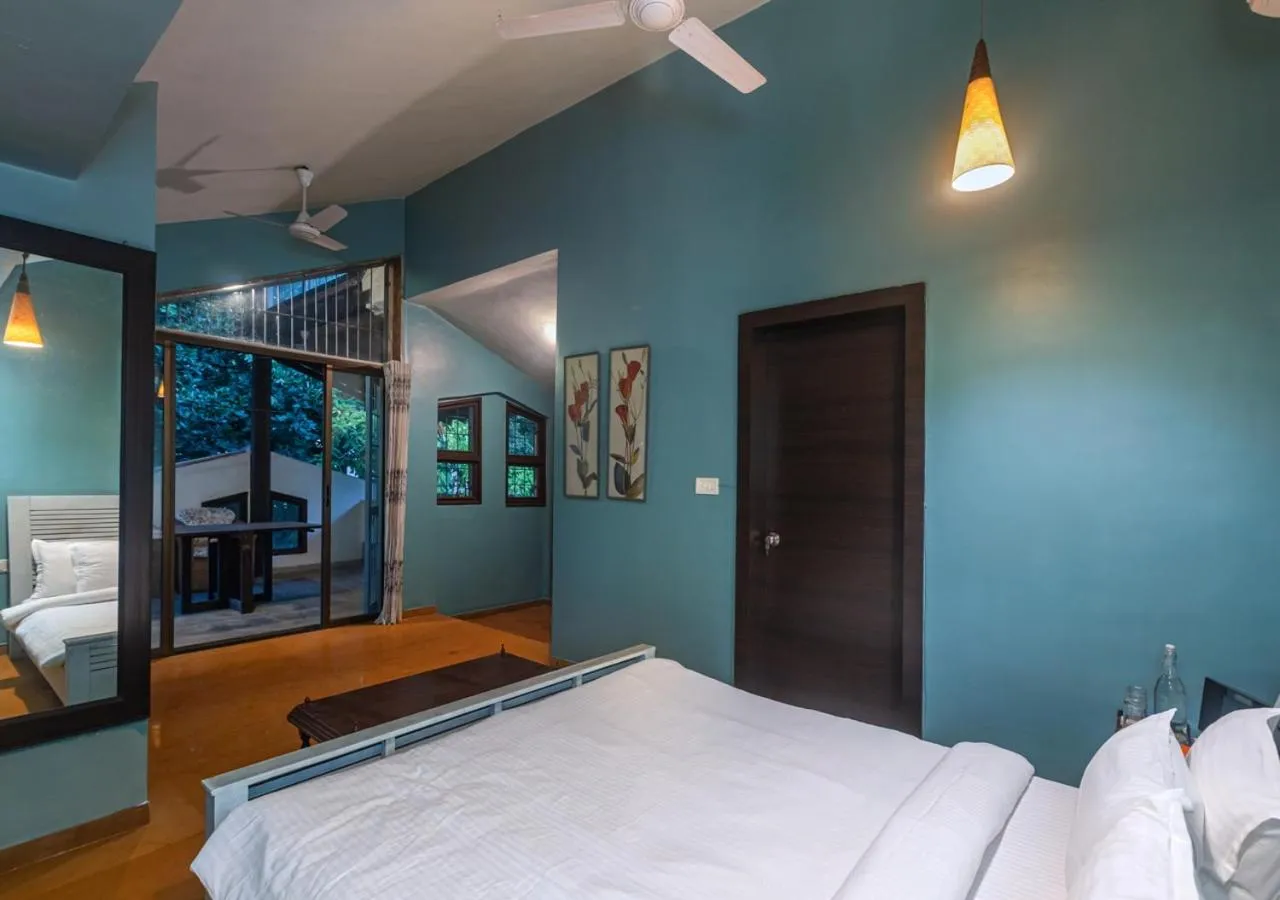 Bed in SaffronStays Oriana, Alibaug