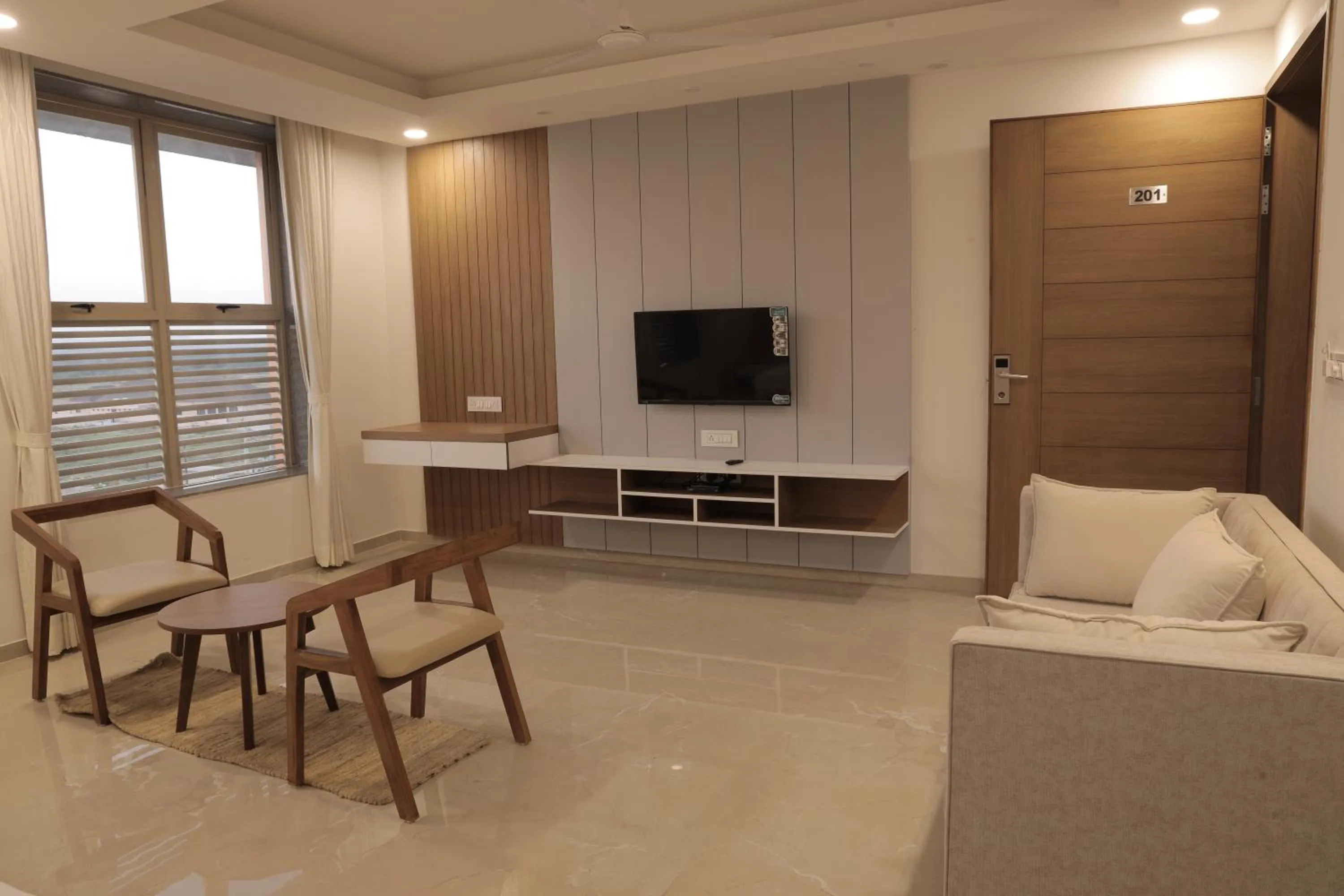 Communal lounge/ TV room in The Presidential Suites