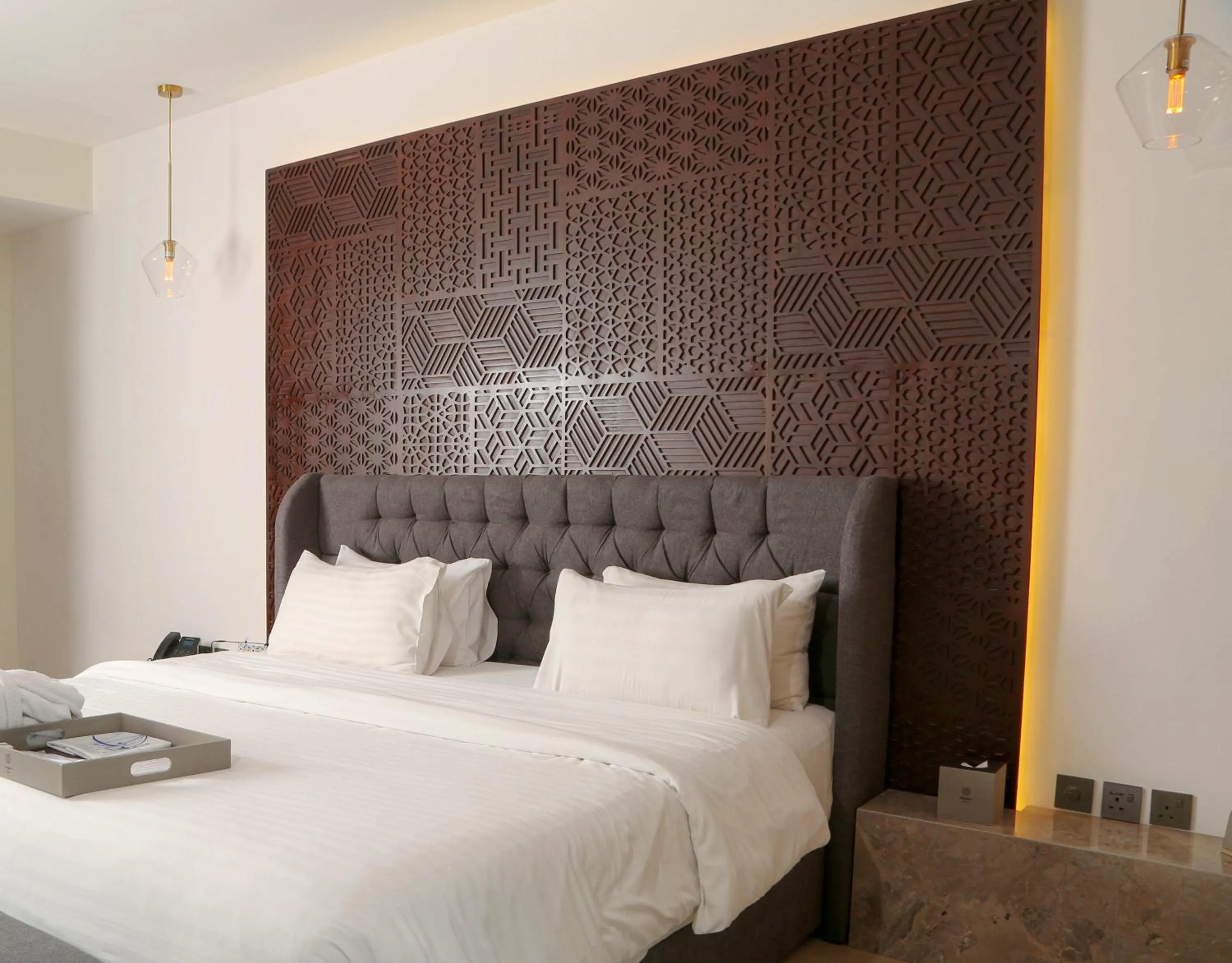 Bed in Tajreed Suites