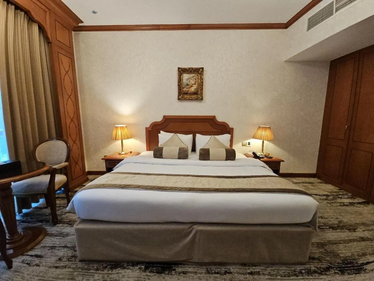 Bed in Royal Concorde Hotel & Suite