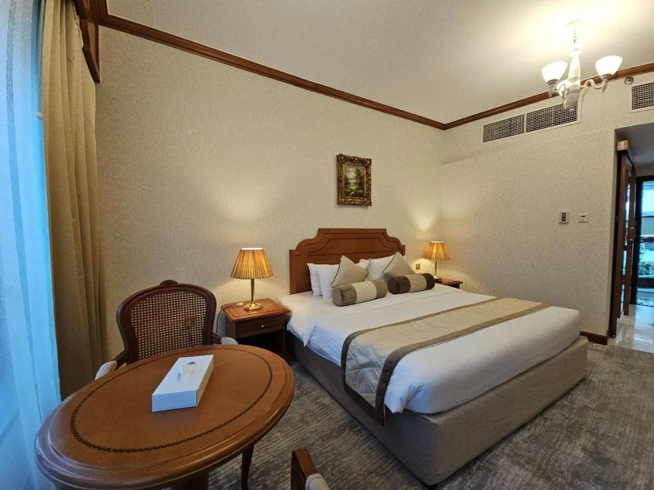 Bed in Royal Concorde Hotel & Suite