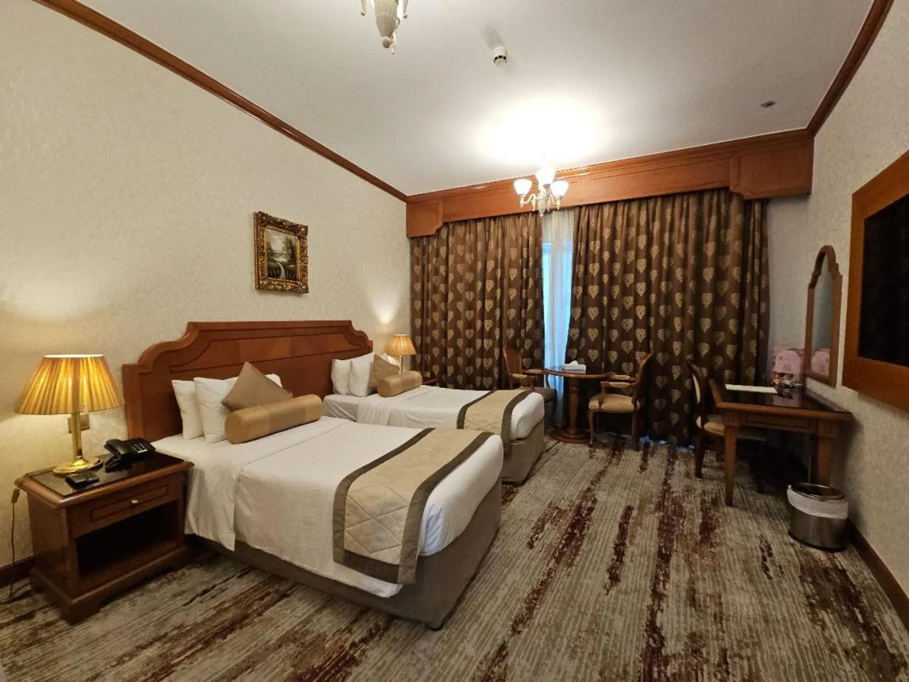 Bed in Royal Concorde Hotel & Suite