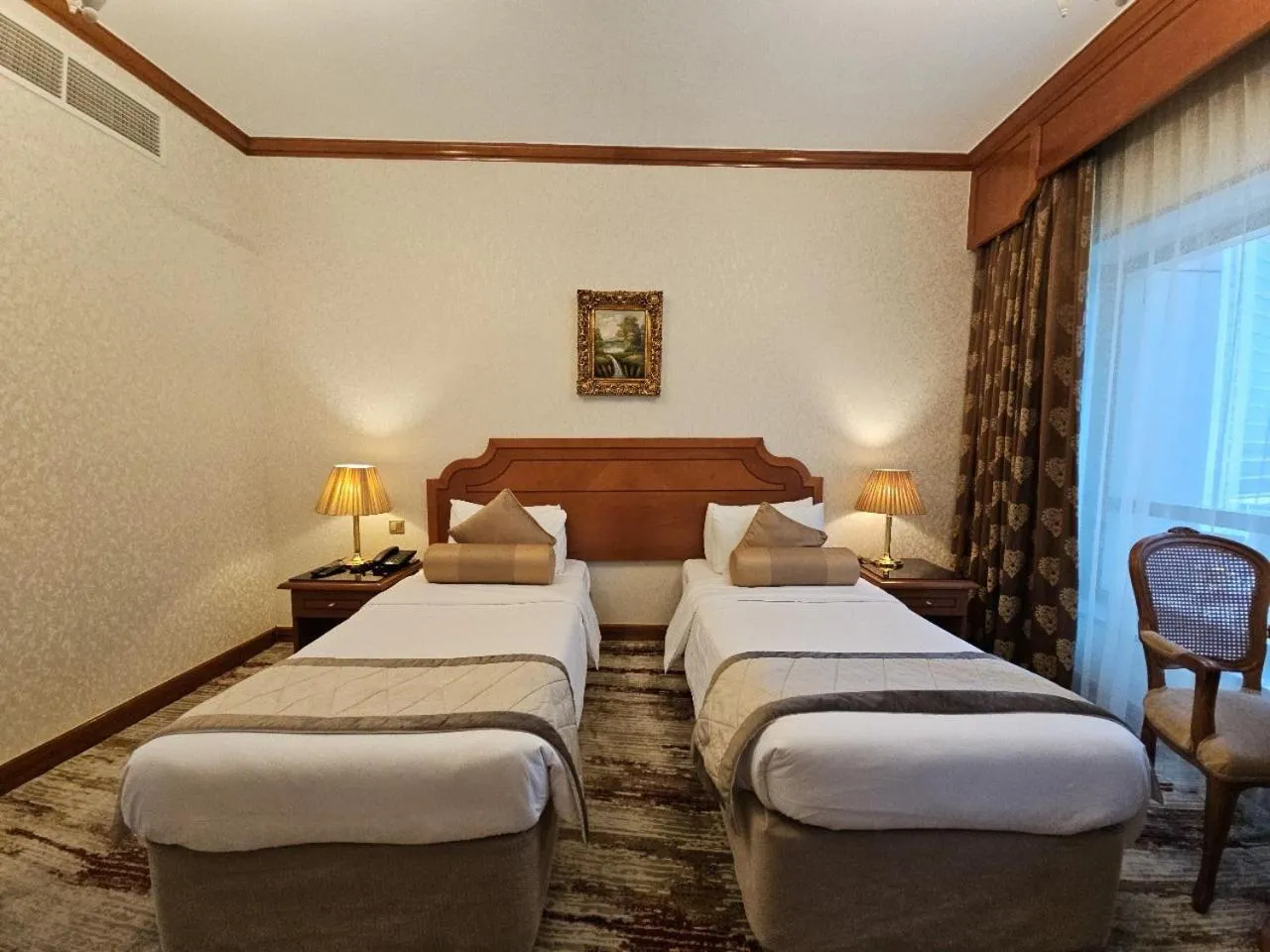 Bed in Royal Concorde Hotel & Suite