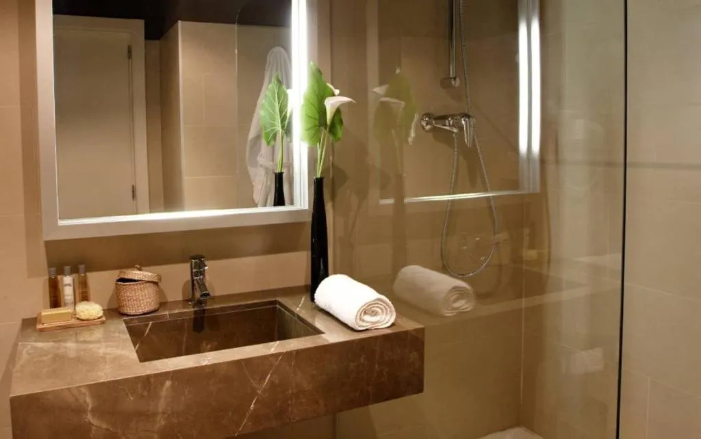 Bathroom in Qgat Restaurant Events & Hotel