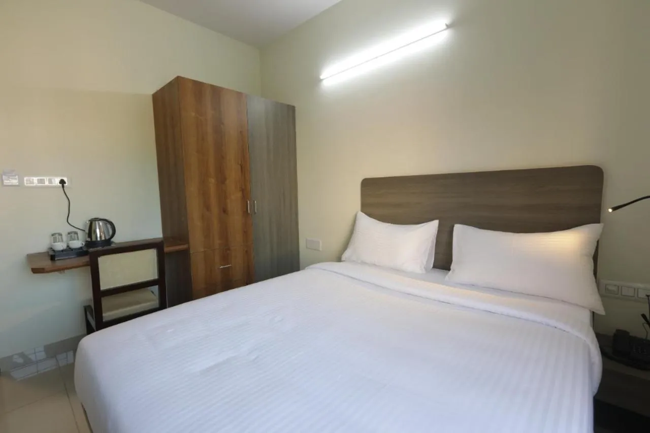 Bed in Elysian Grand Hotel