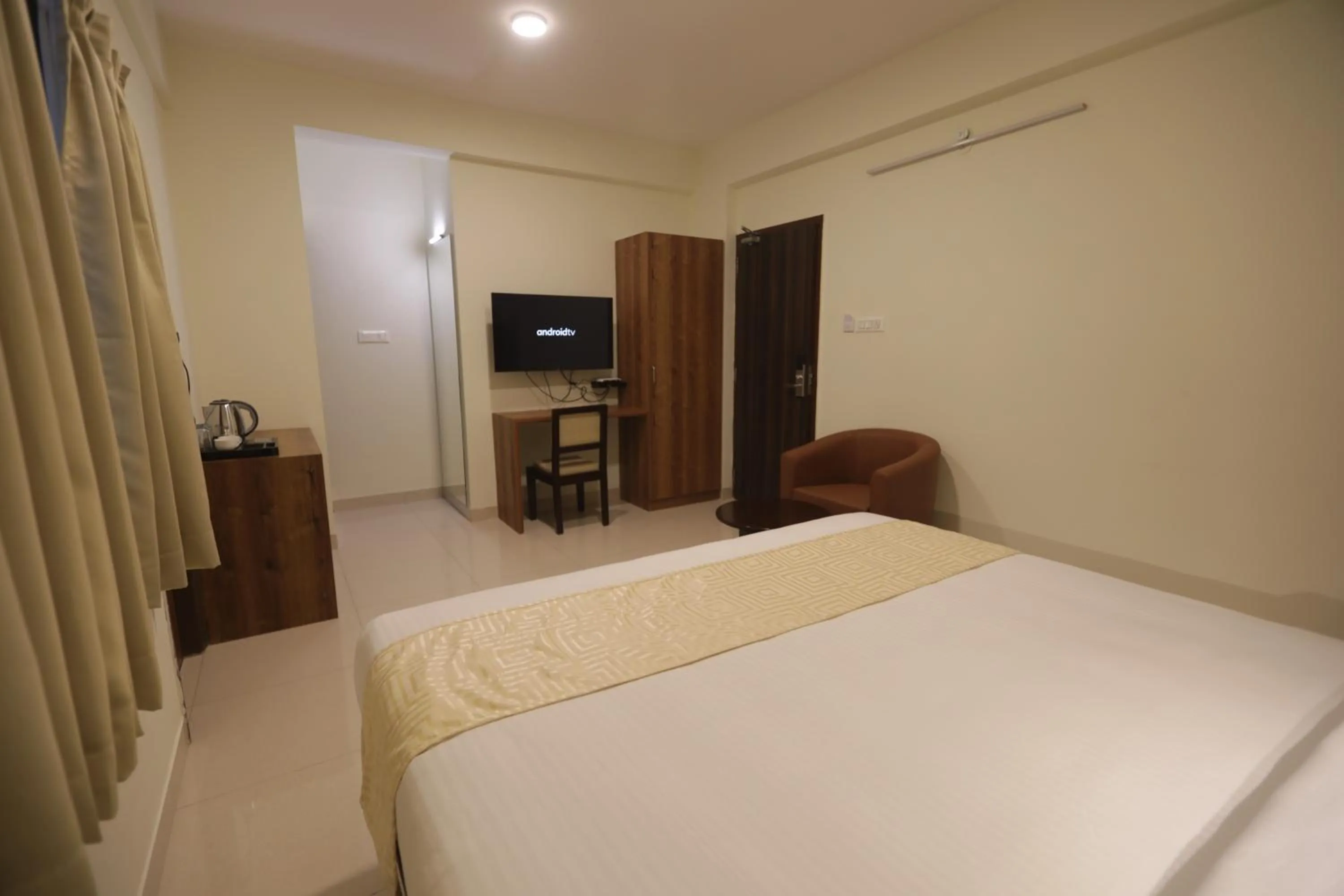 Bed in Elysian Grand Hotel