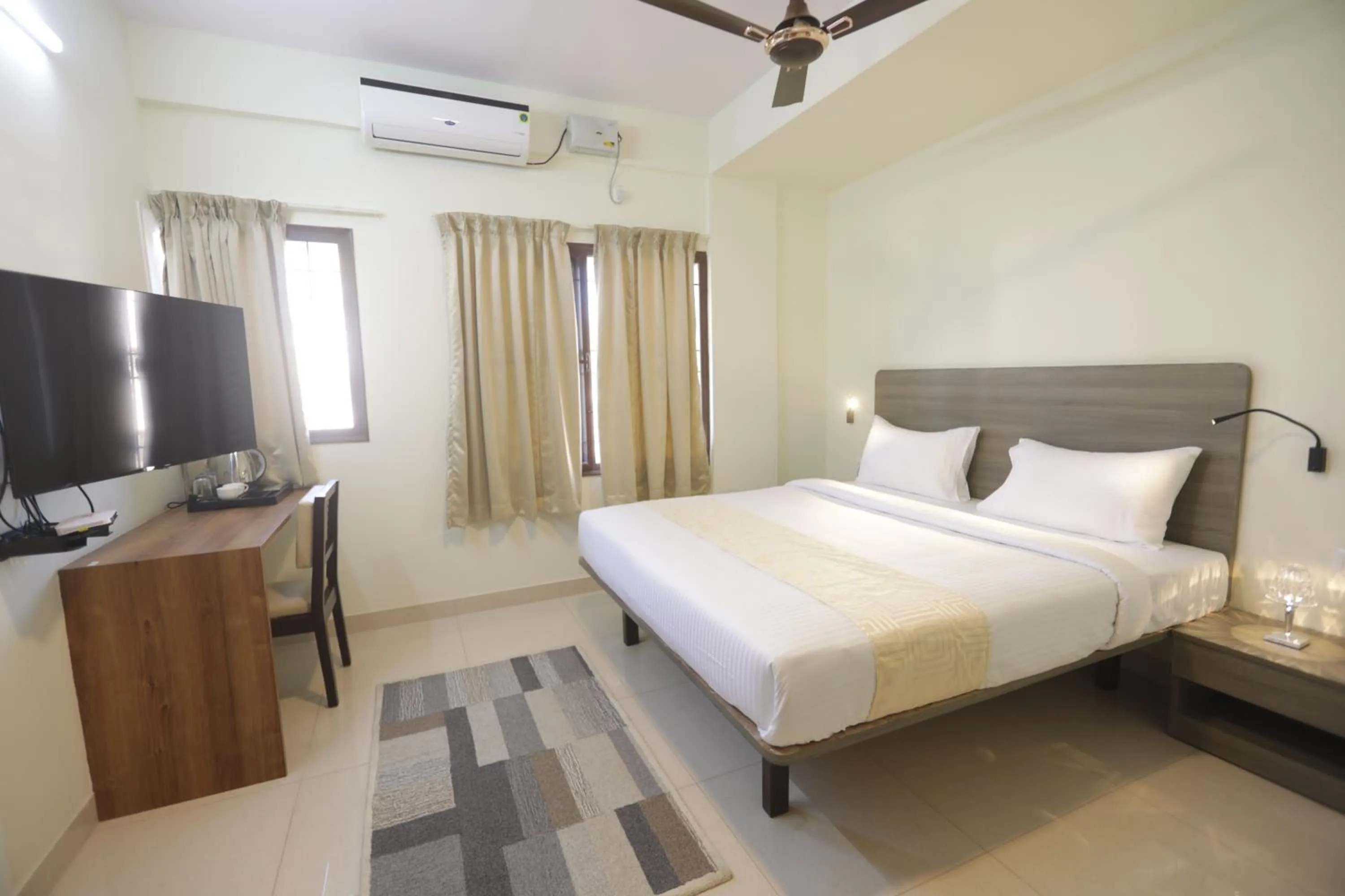 Bed in Elysian Grand Hotel