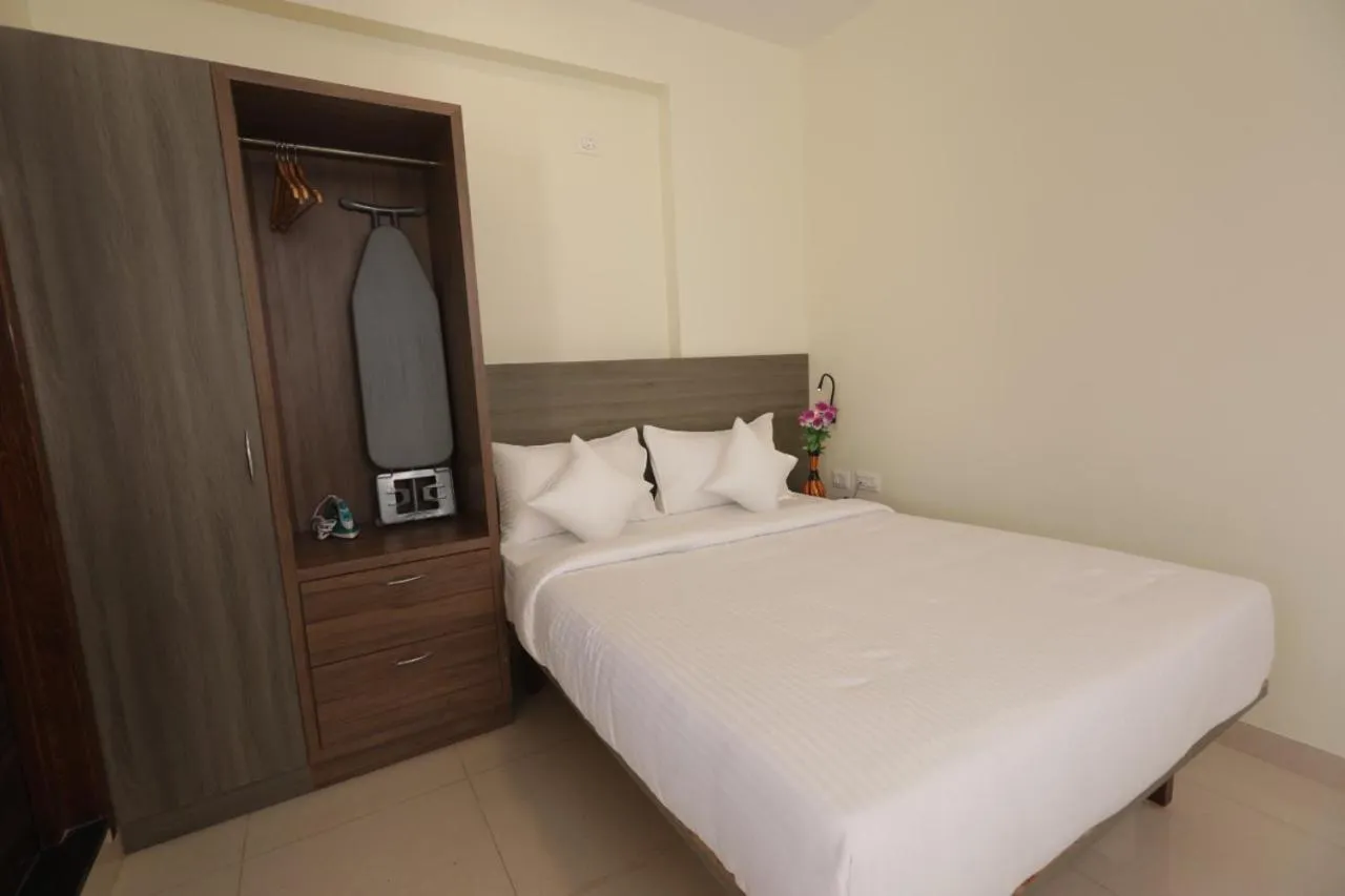 Bed in Elysian Grand Hotel