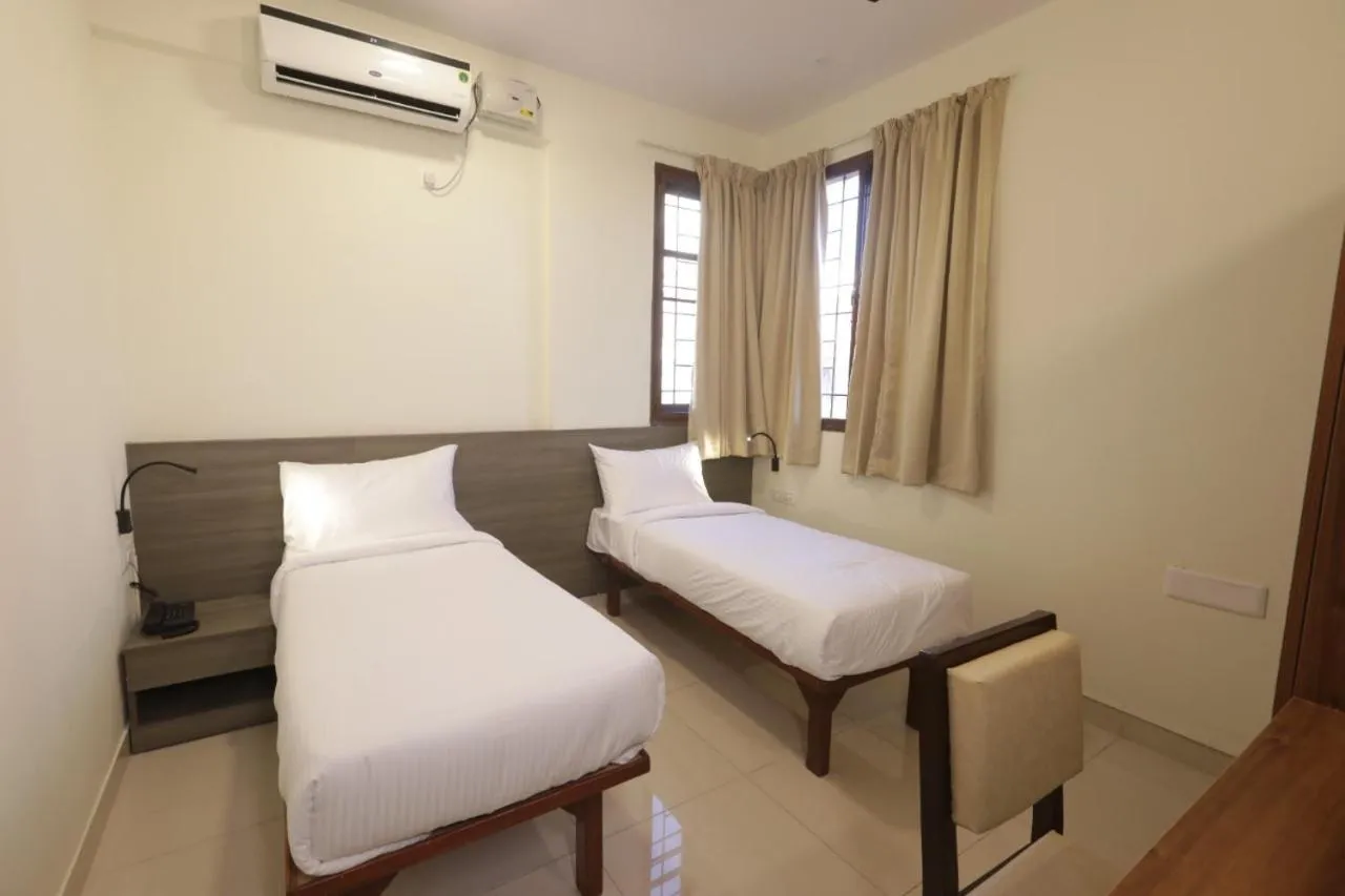 Bed in Elysian Grand Hotel