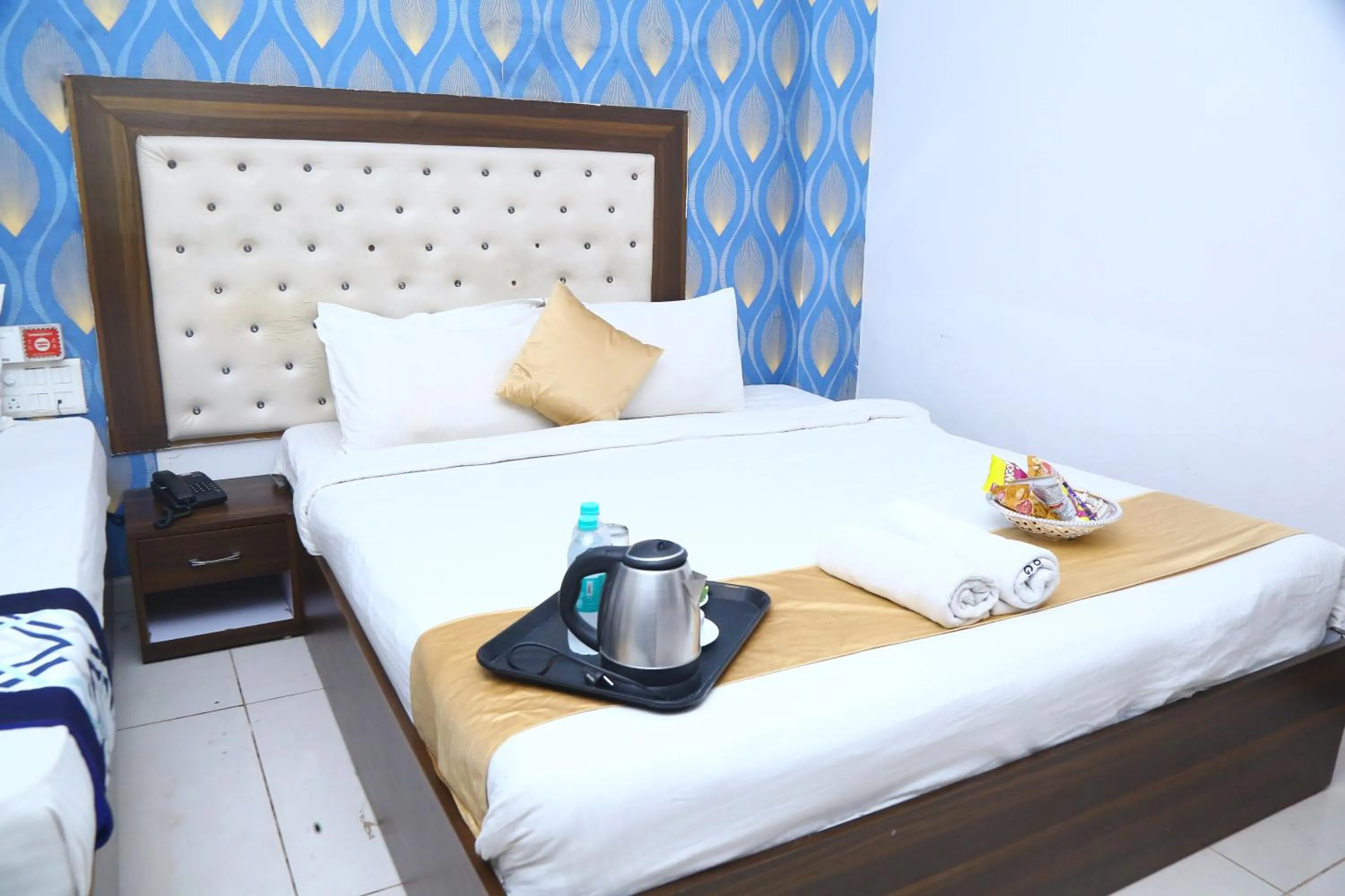 Coffee/tea facilities, Bed in Hotel MN Grand Shamshabad Airport Zone Hyderabad