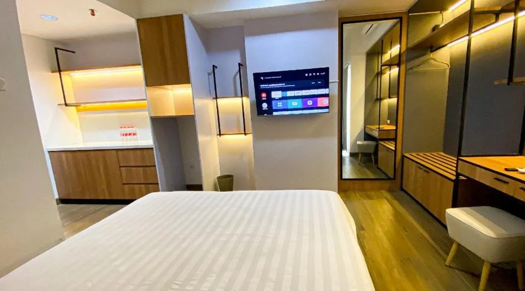 Bed in Menara One Hotel by Menara Santosa