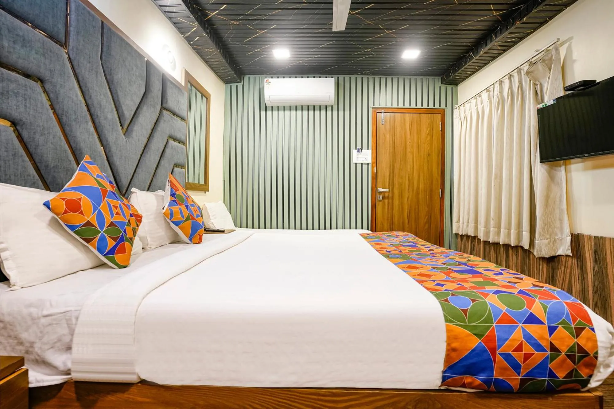 Bed in FabHotel Malali Residency