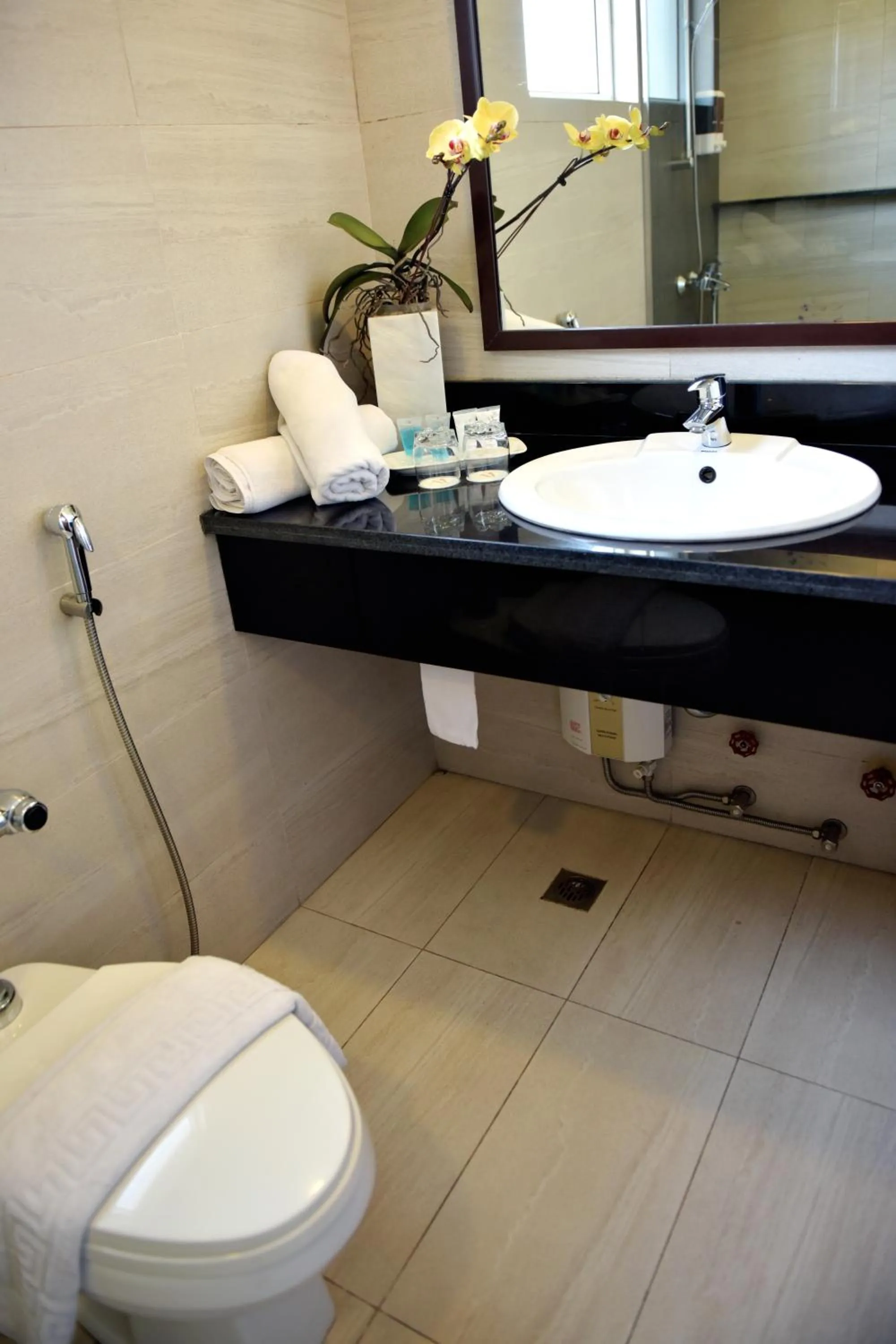 Toilet in Aura One Hotel