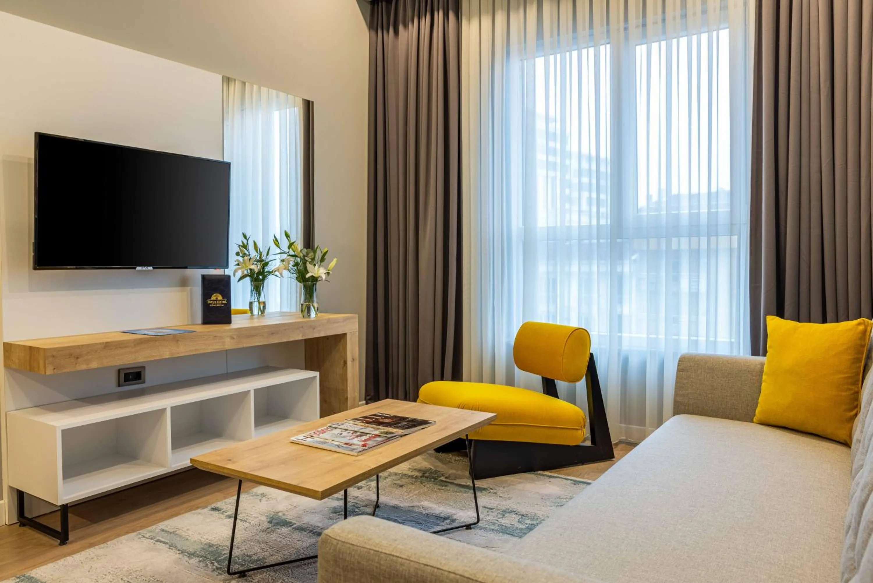 Communal lounge/ TV room in Days Inn & Suites by Wyndham Istanbul Esenyurt