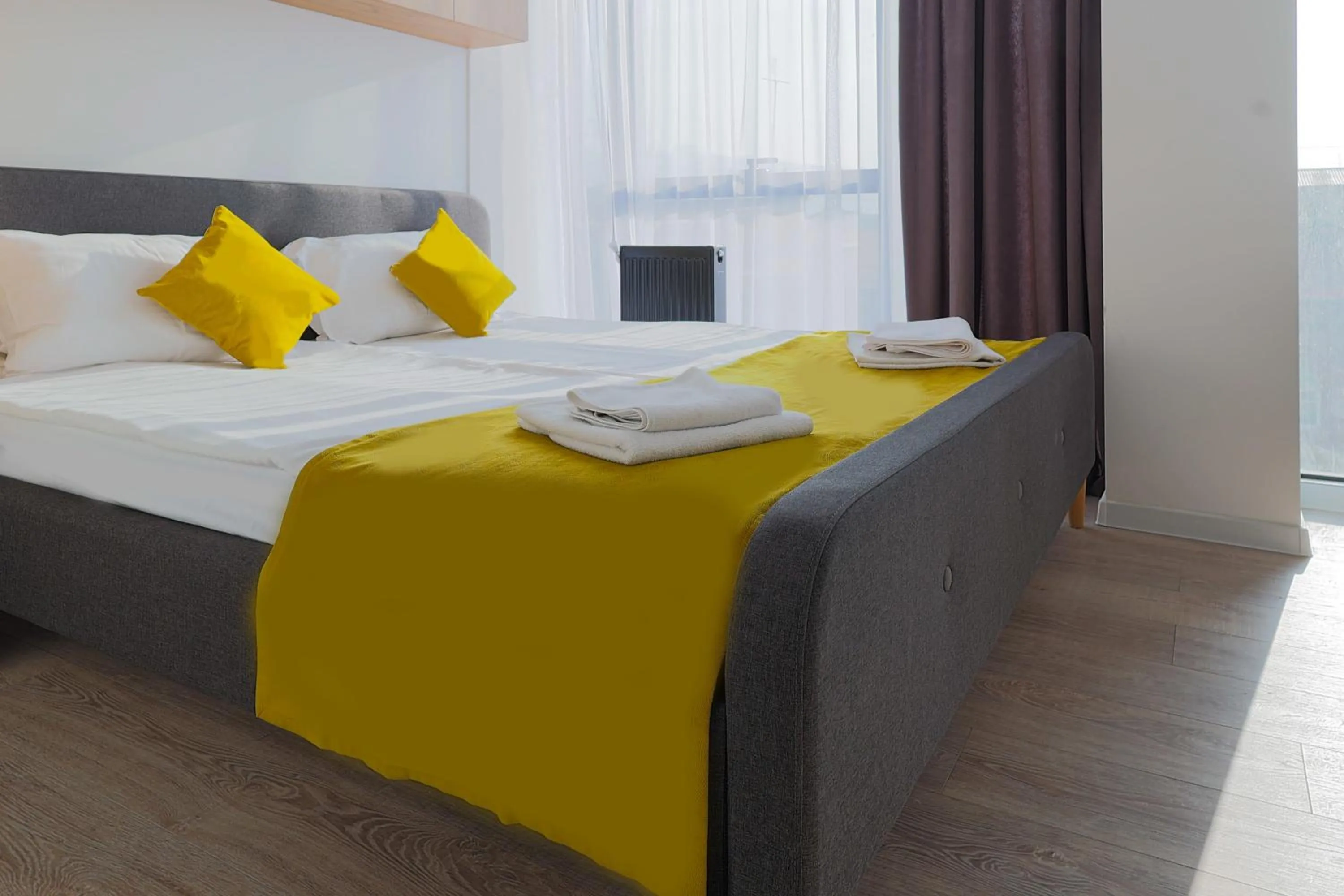 Bed in Welcome Republic Square Apartments