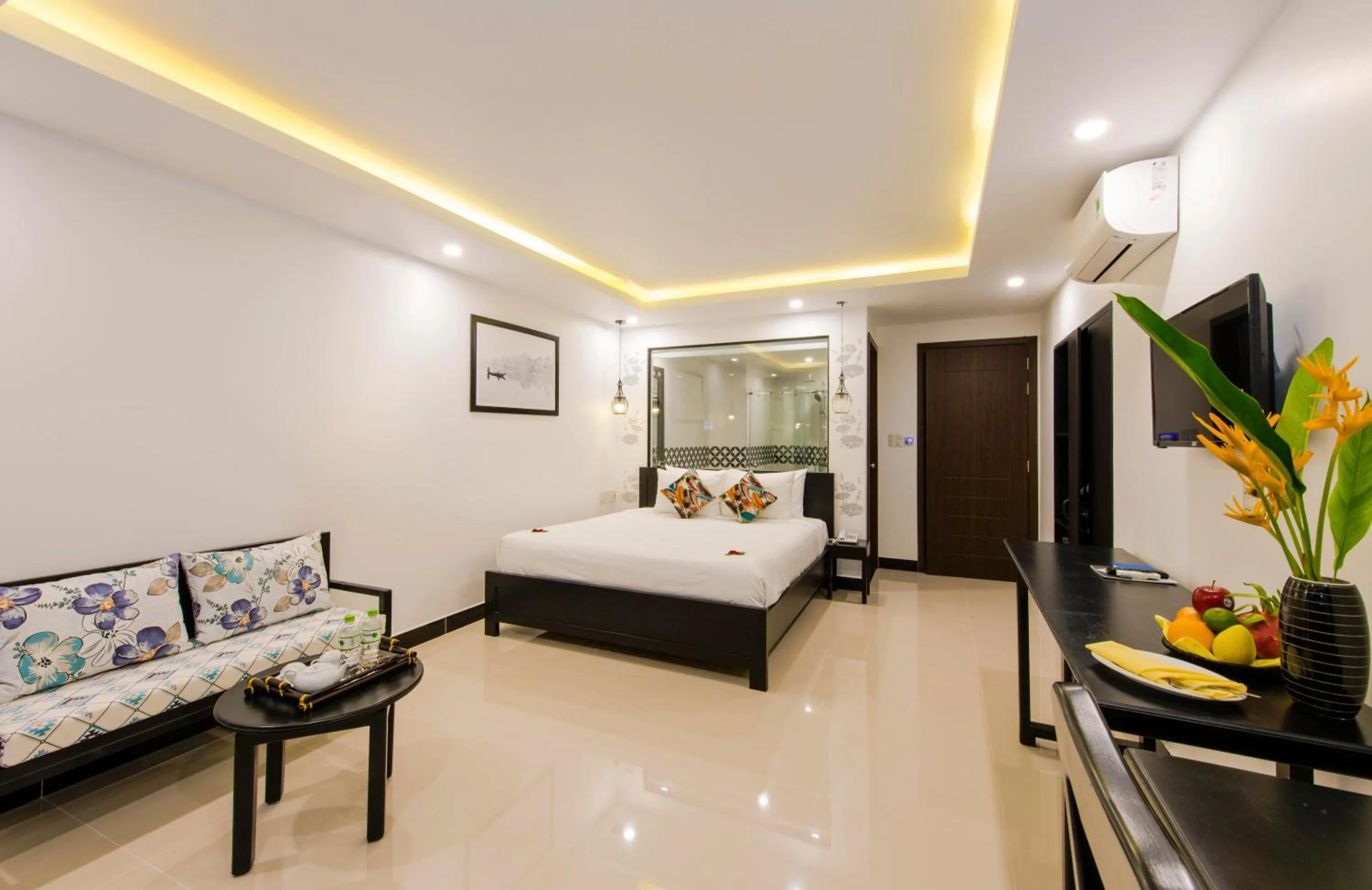 Living room, Bed in Gem Riverside Hotel Hoi An