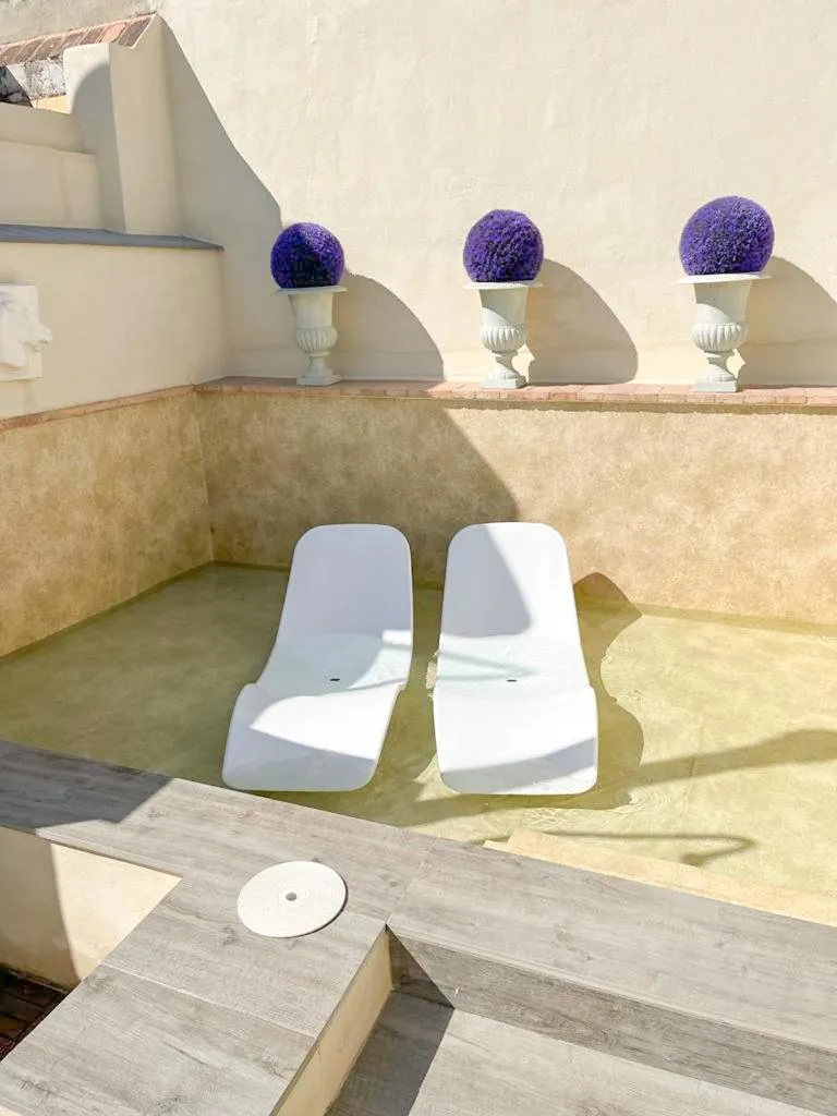 Swimming pool in Hostal Hom Museo