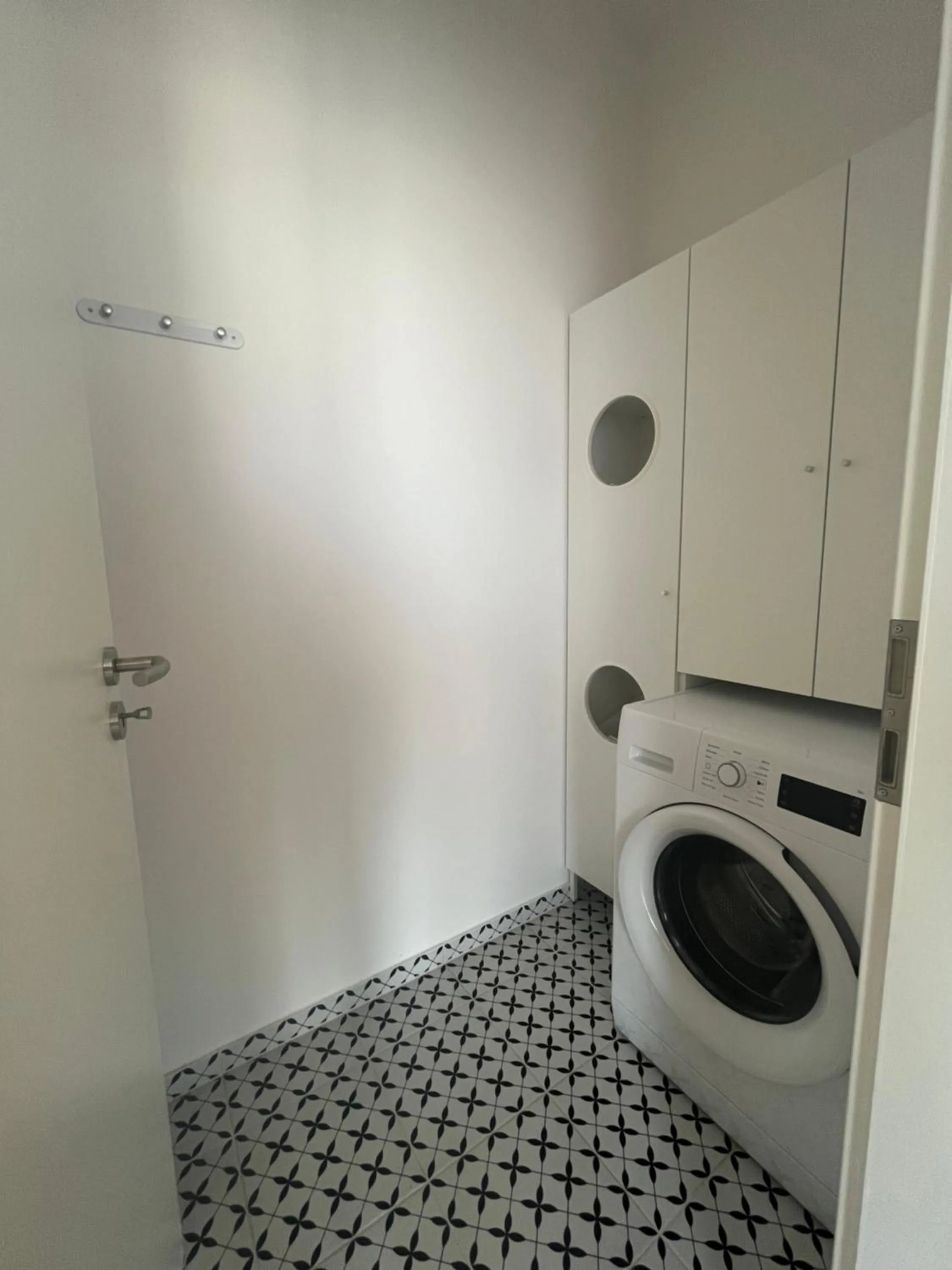 washing machine in WaterFront City Apartments by FirstHost