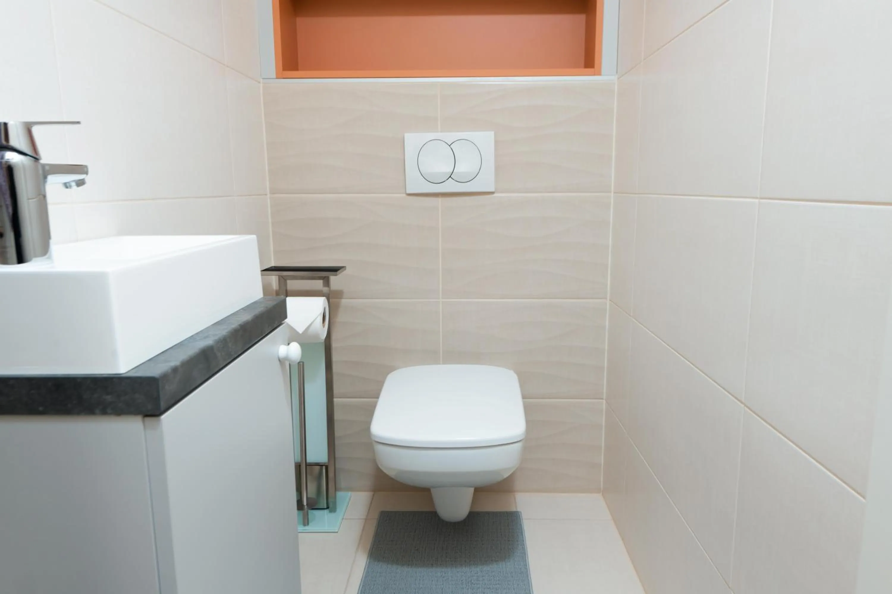 Toilet in WaterFront City Apartments by FirstHost