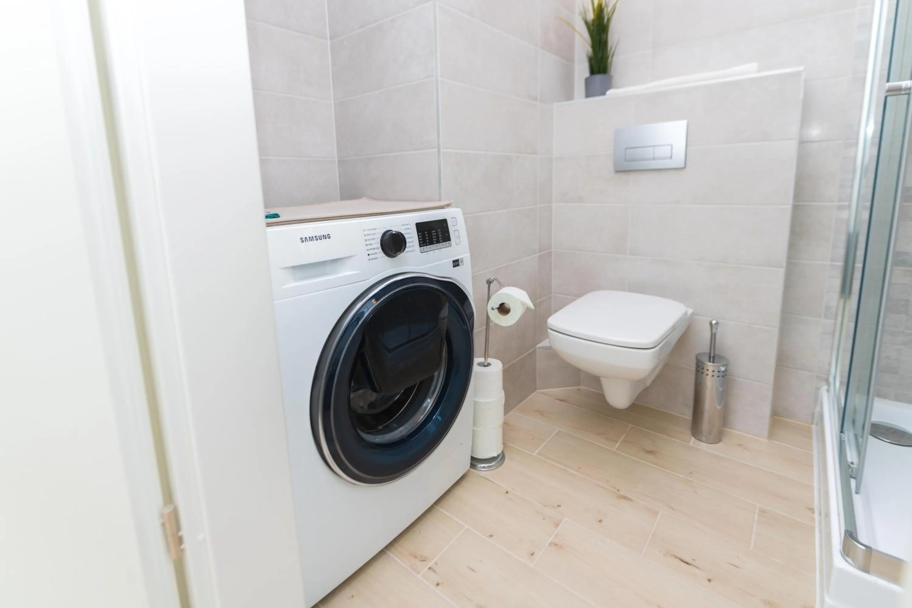 Shower in WaterFront City Apartments by FirstHost