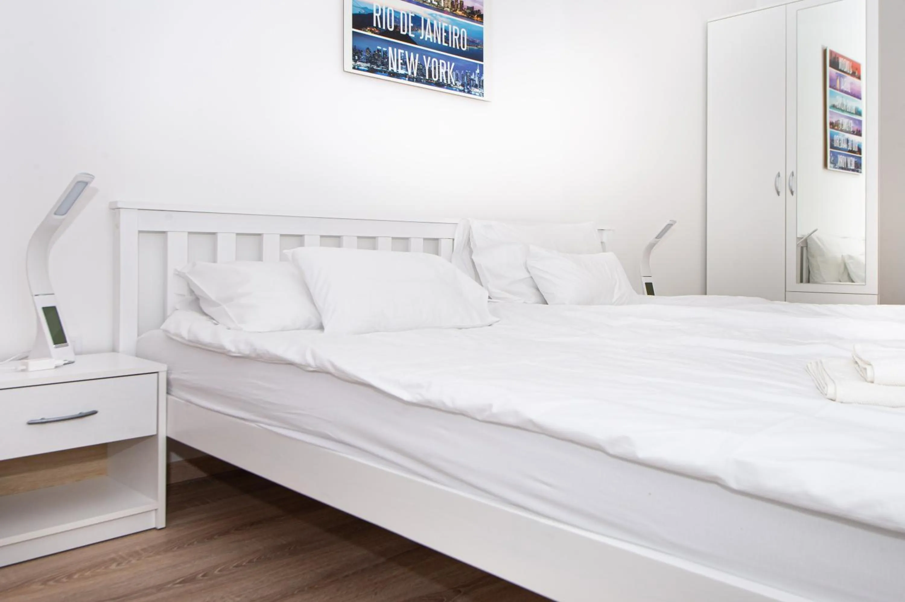 Bed in WaterFront City Apartments by FirstHost