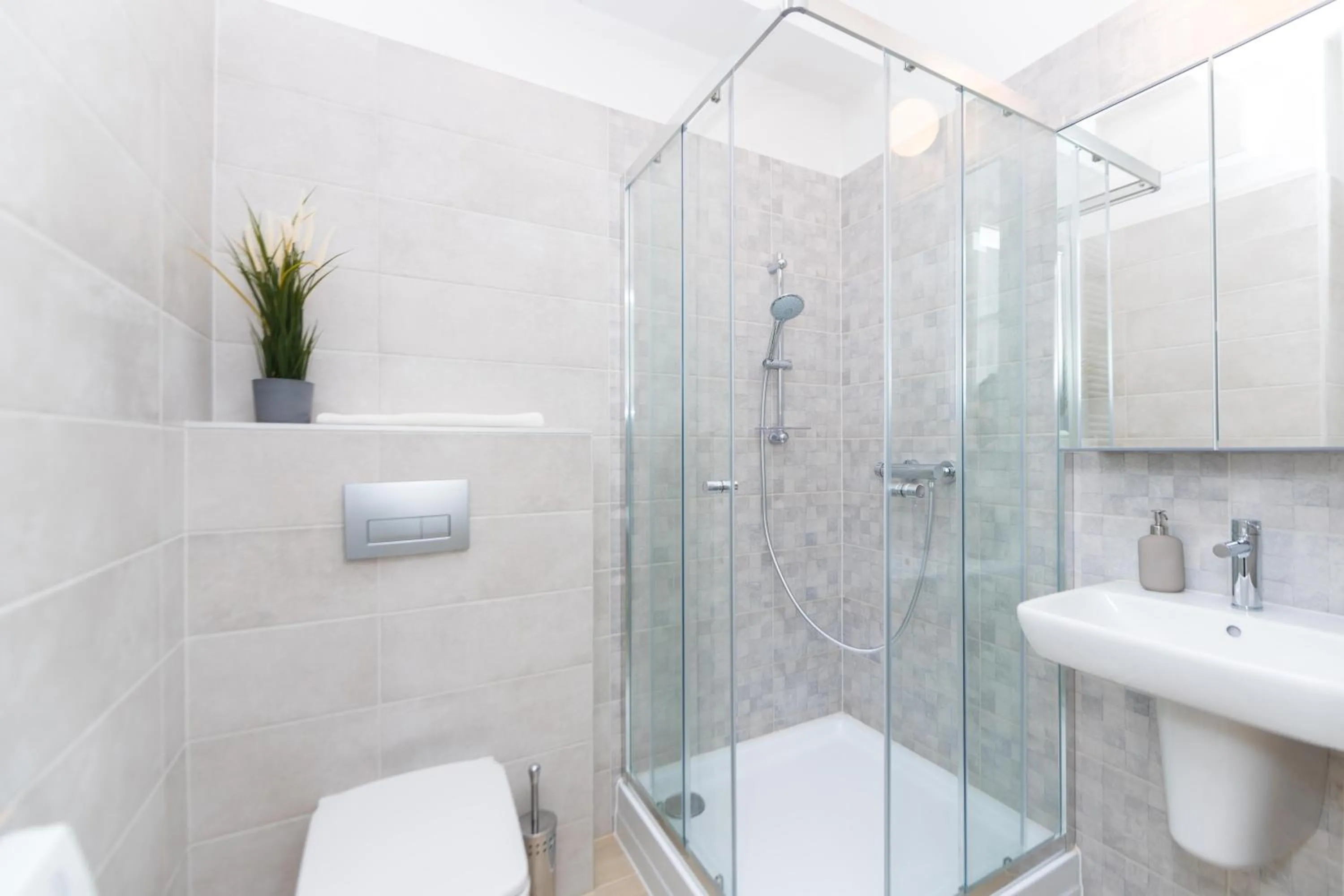 Shower in WaterFront City Apartments by FirstHost