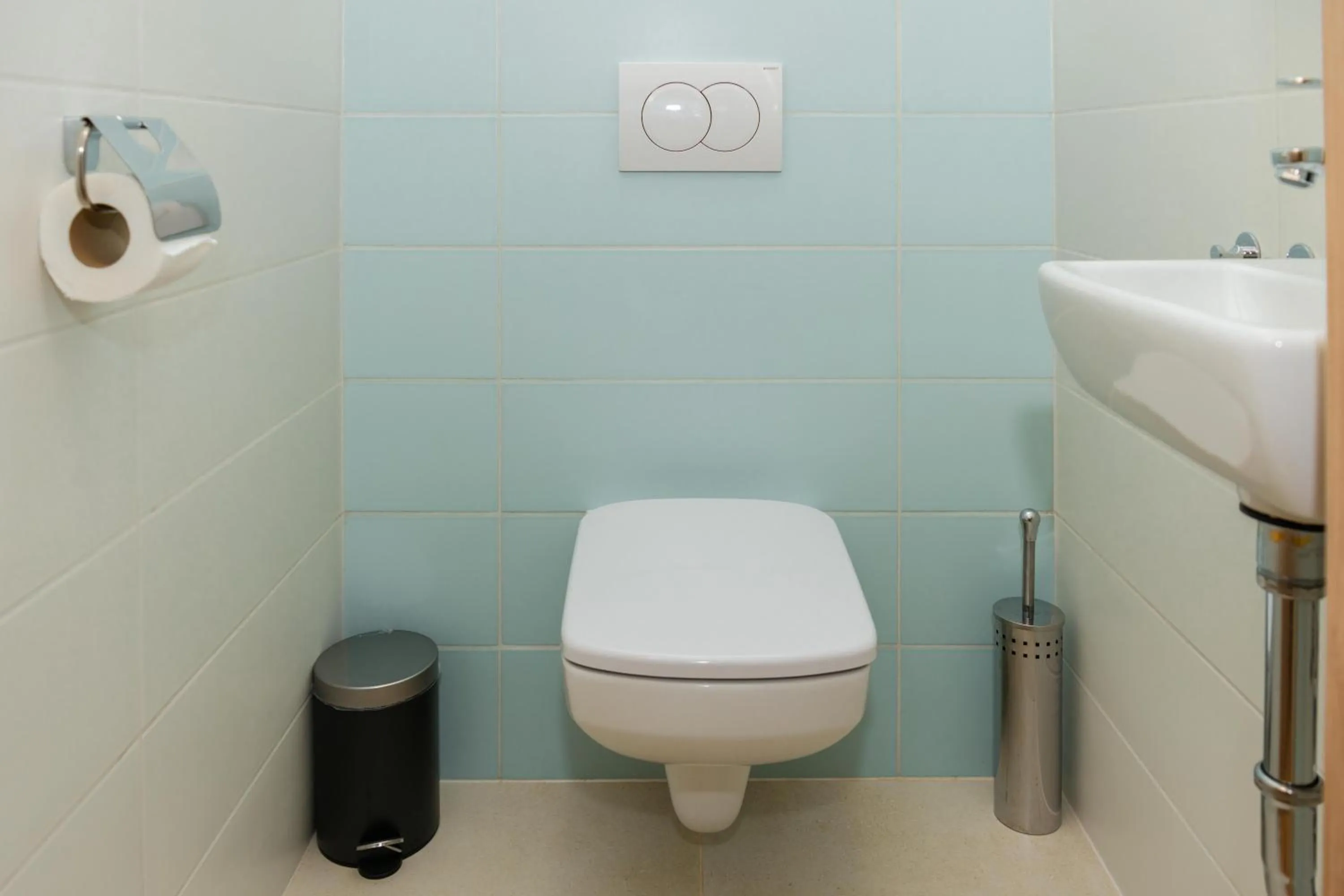 Toilet in WaterFront City Apartments by FirstHost