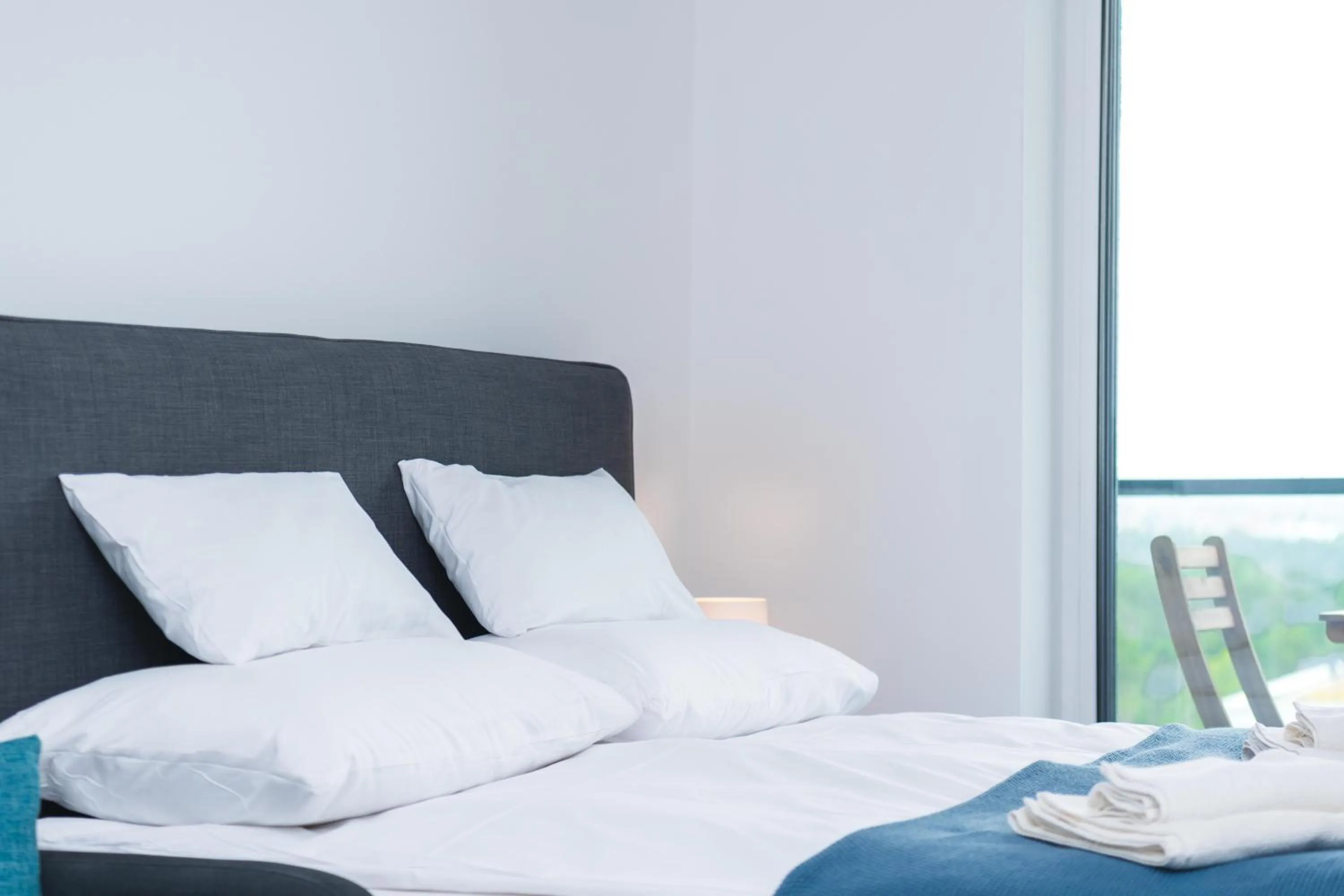 Bed in WaterFront City Apartments by FirstHost