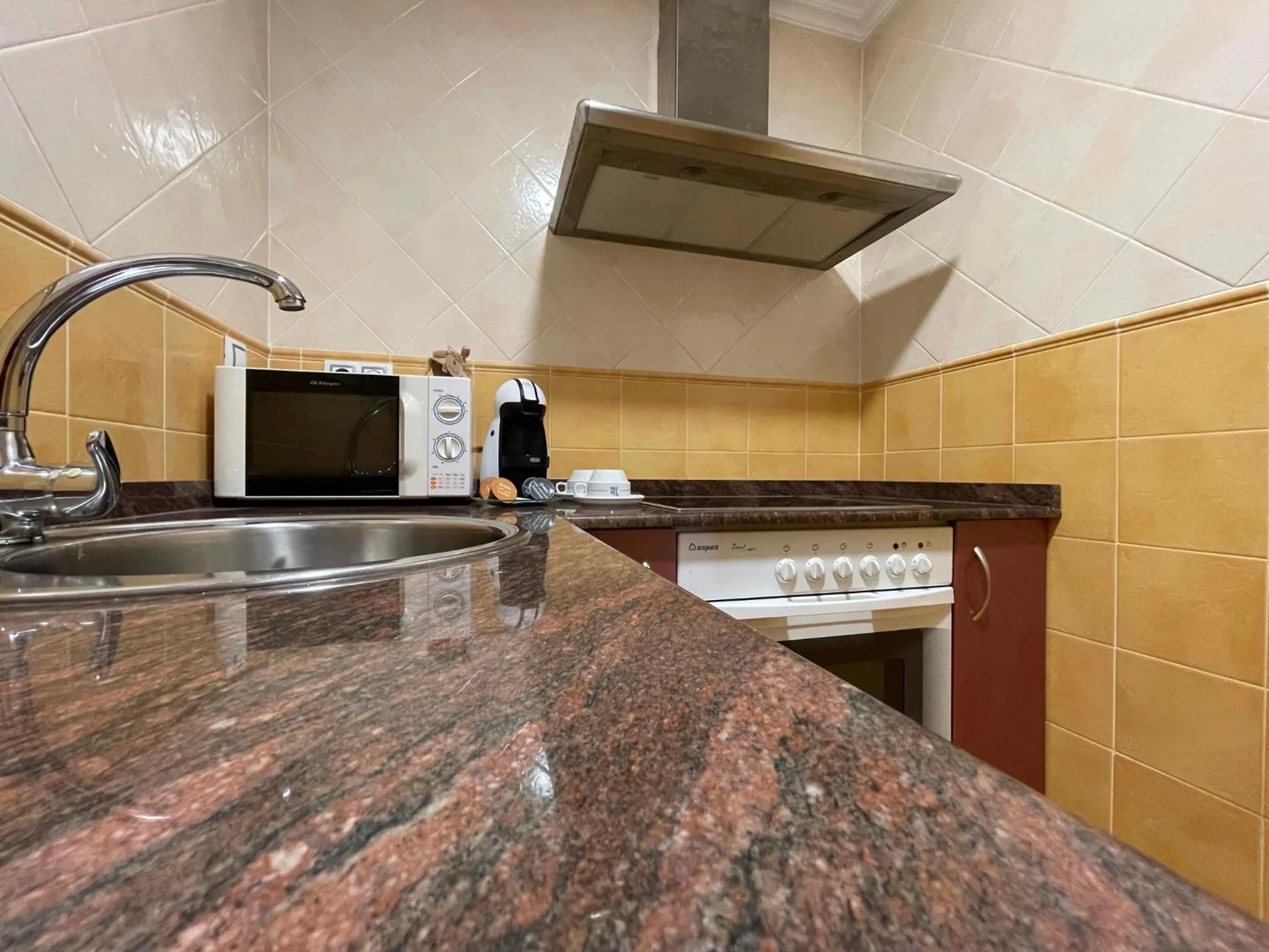 Kitchen or kitchenette in Aparthotel Arenteiro